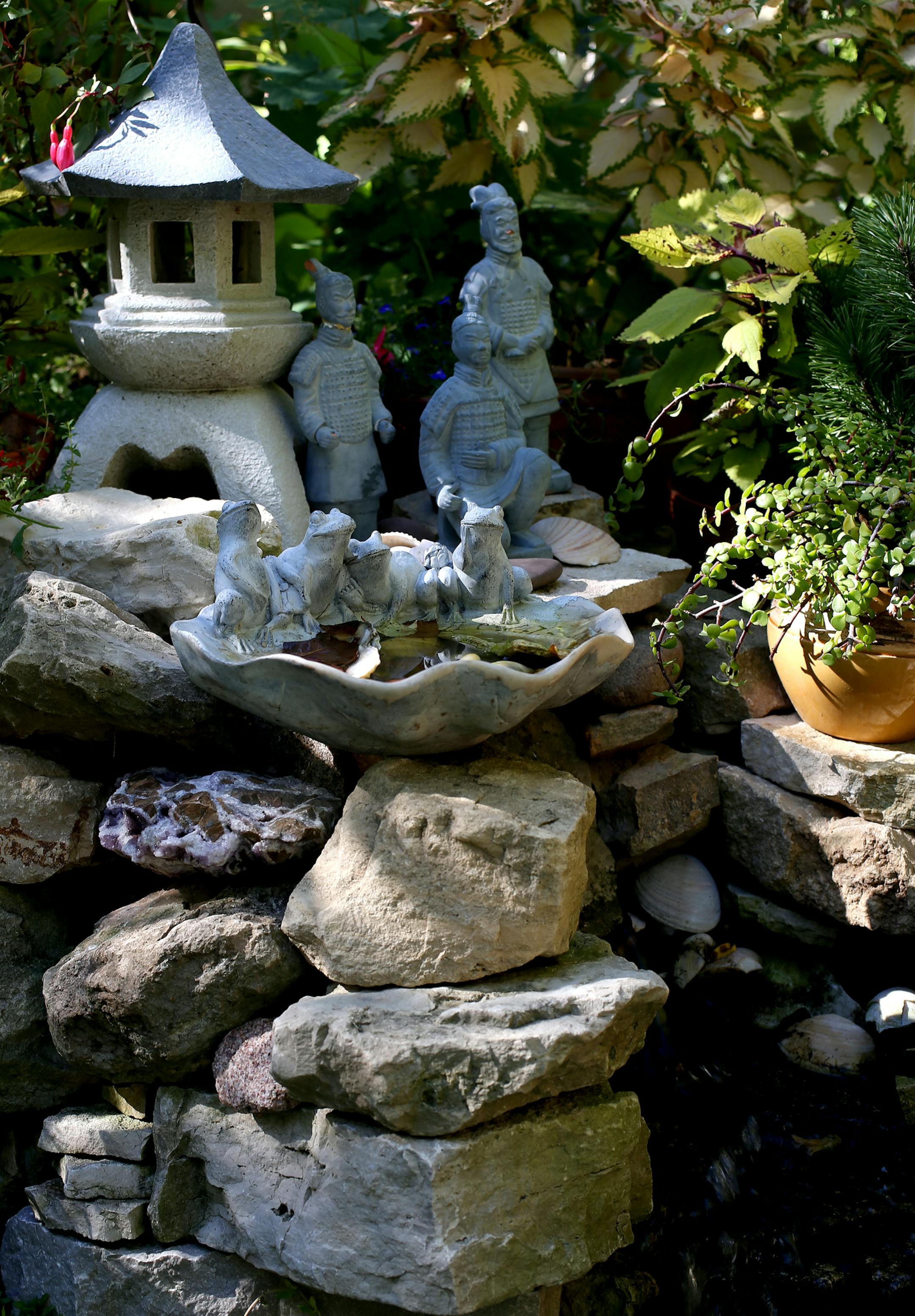 Catherine Navalta Japanese-inspired garden won top honors in New Hope's suburban home awards. Catherine is a born caregiver. She is a registered nurse helping patients recovering from brain injuries and strokes. At home she nurses her spectacular flower garden. She grew up in the Phillipines and remembers the scent of gardenias wafting from her mother's flower garden. New Hope, MN on October 9, 2013. ] JOELKOYAMA‚Ä¢joel koyama@startribune