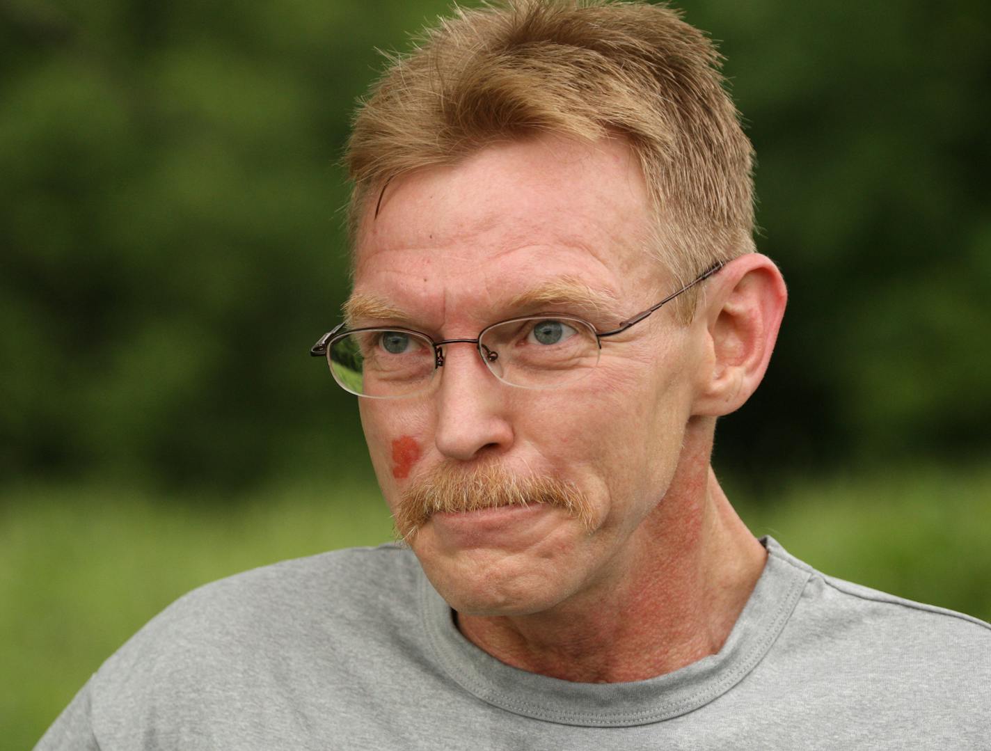 Dean Laiti during a pause in his training run Tuesday evening near Cedar Lake in Minneapolis.