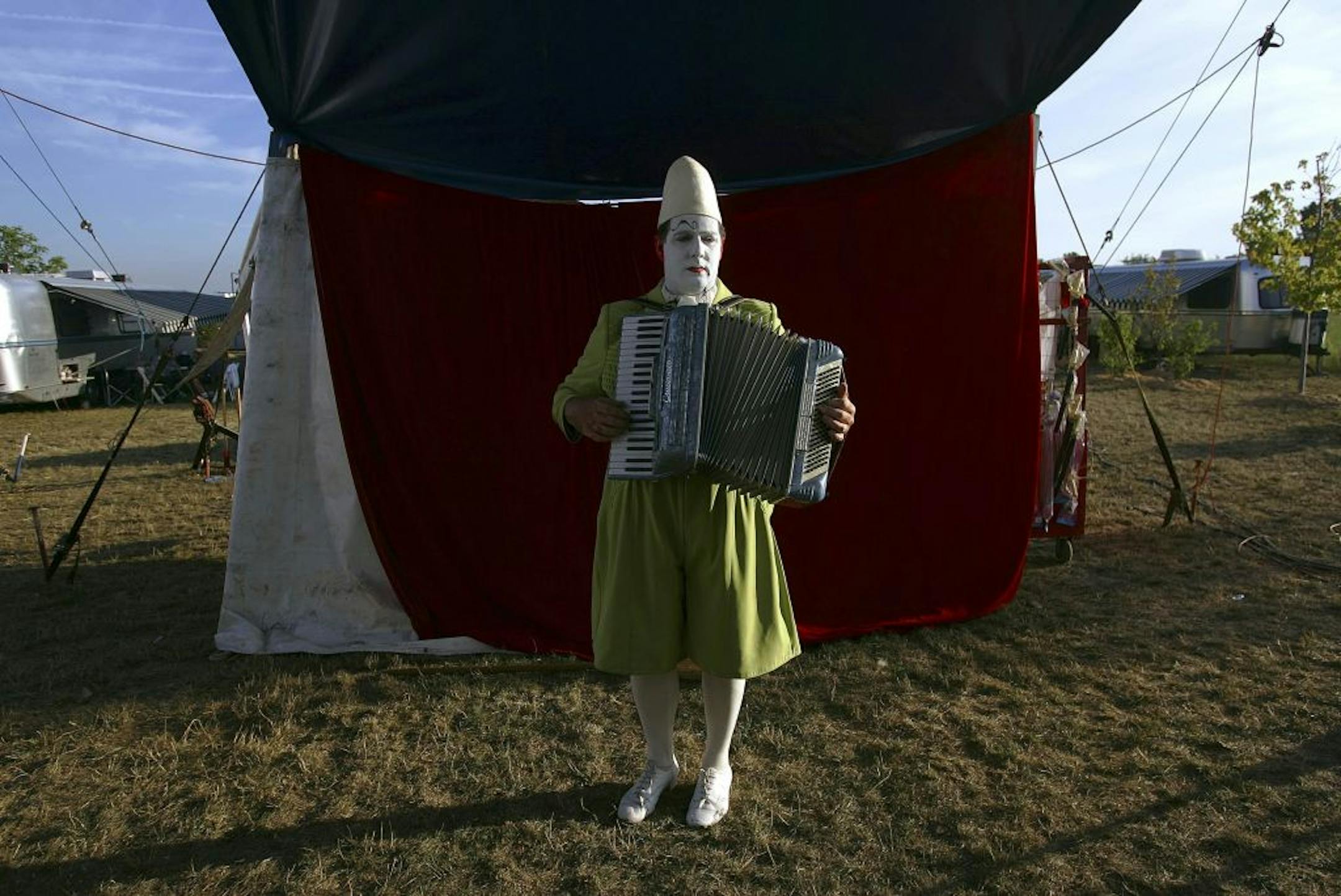 Jay Walther, an Italian clown narrator, practices songs on an accordion before a performance of the Zopp� Family Circus in Schaumburg, Ill., Aug. 5, 2005. The Zopp� family has been in the business since 1842, and its performances evoke the European circuses of long ago for audiences at county fairs and in suburbs.
