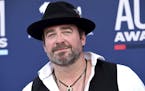 In this Sunday, April 7, 2019, photo, Lee Brice arrives at the 54th annual Academy of Country Music Awards at the MGM Grand Garden Arena in Las Vegas.