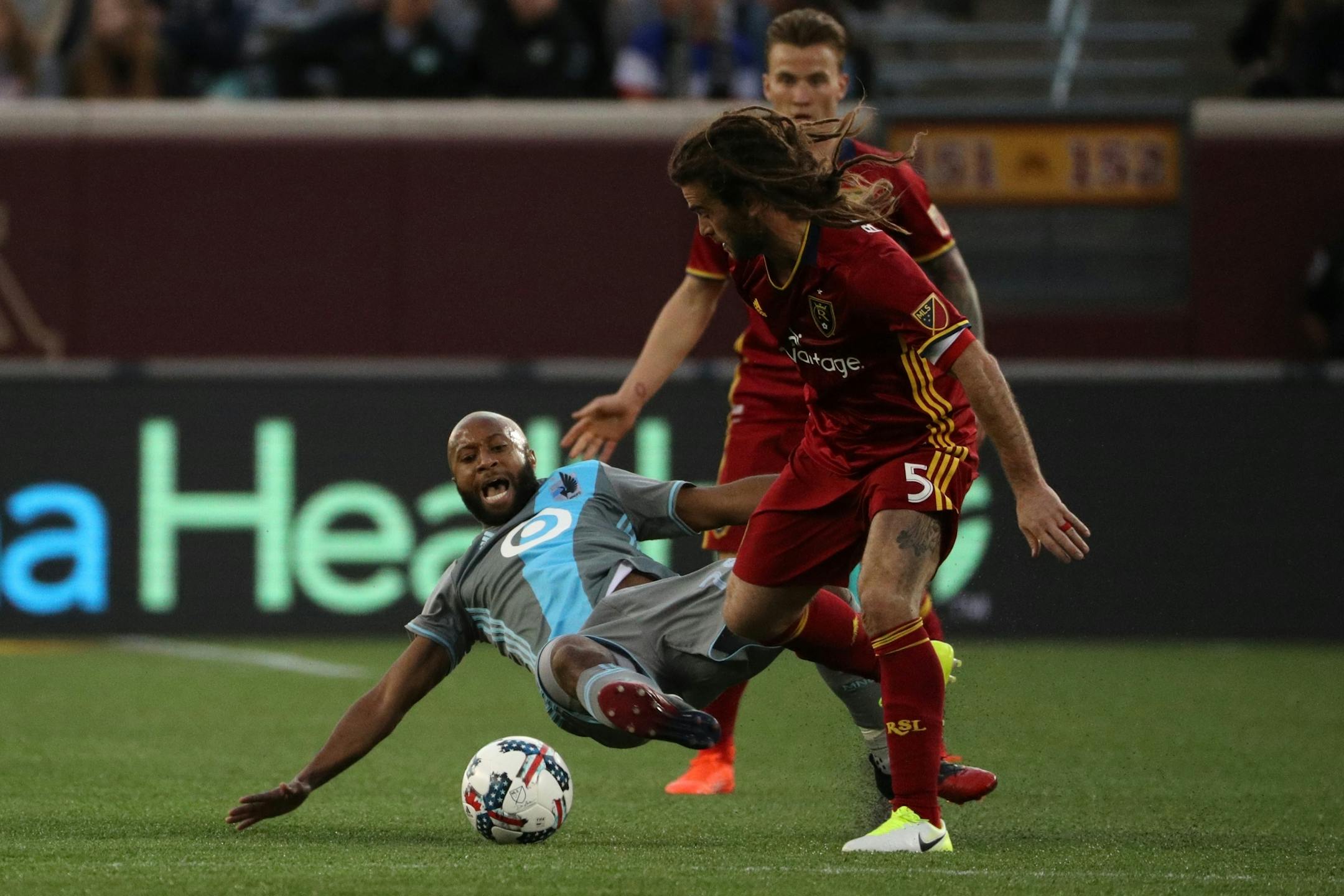 Minnesota United midfielder Collen Warner (26) fell as he went up against Real Salt Lake midfielder Kyle Beckerman (5) for the ball in the first half.