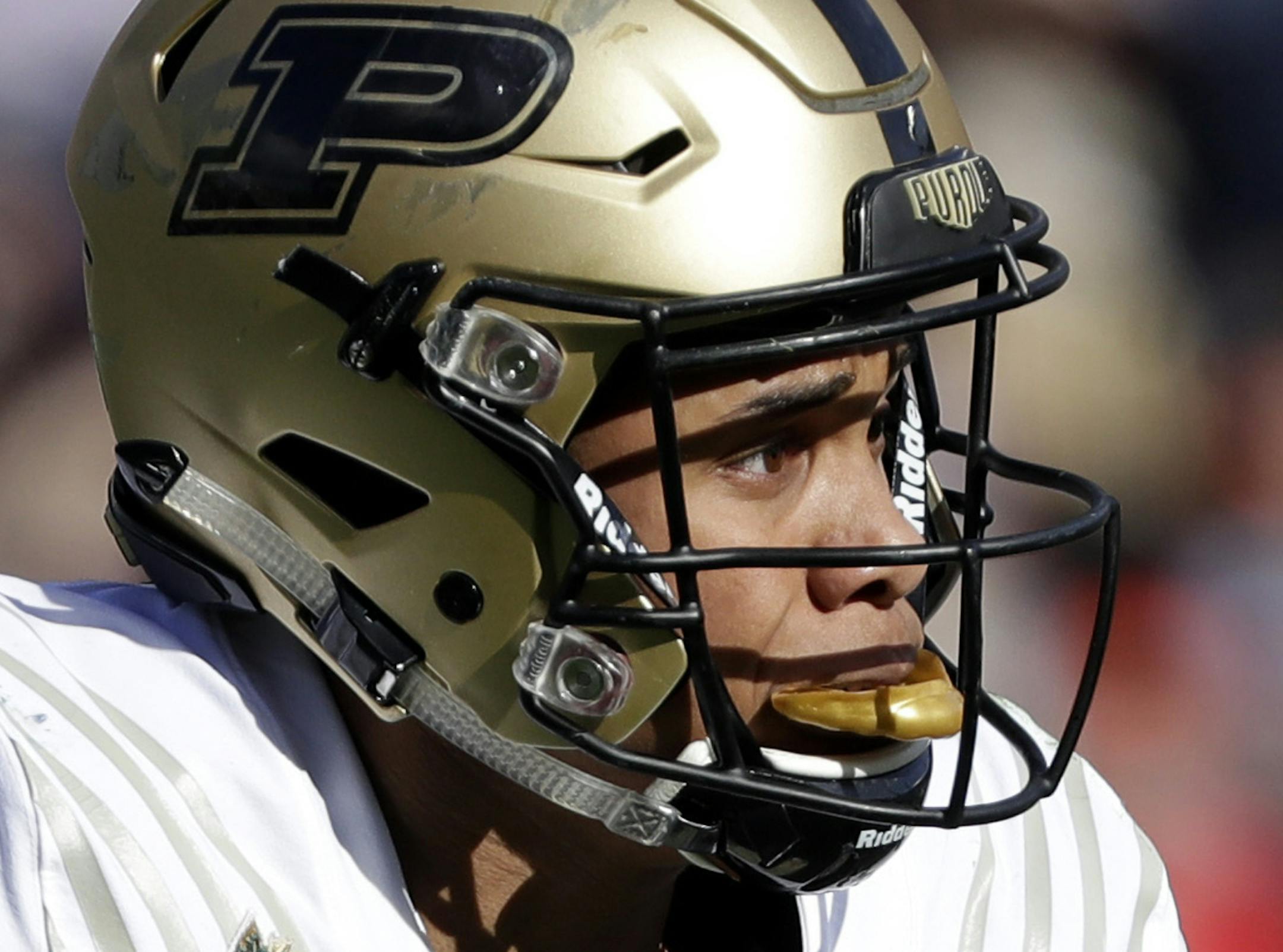 FILE - In this Dec. 28, 2018, file photo, Purdue wide receiver Rondale Moore runs against Auburn in the first half of the Music City Bowl NCAA college football game, in Nashville, Tenn. Purdue receiver Rondale Moore and Nevada running back Toa Taua each made a big mark on his respective team as a freshman. Now it’s time to see what they’ll do for an encore, beginning Friday night when Nevada hosts Purdue in the season opener for both teams. (AP Photo/Mark Humphrey, File) ORG XMIT: