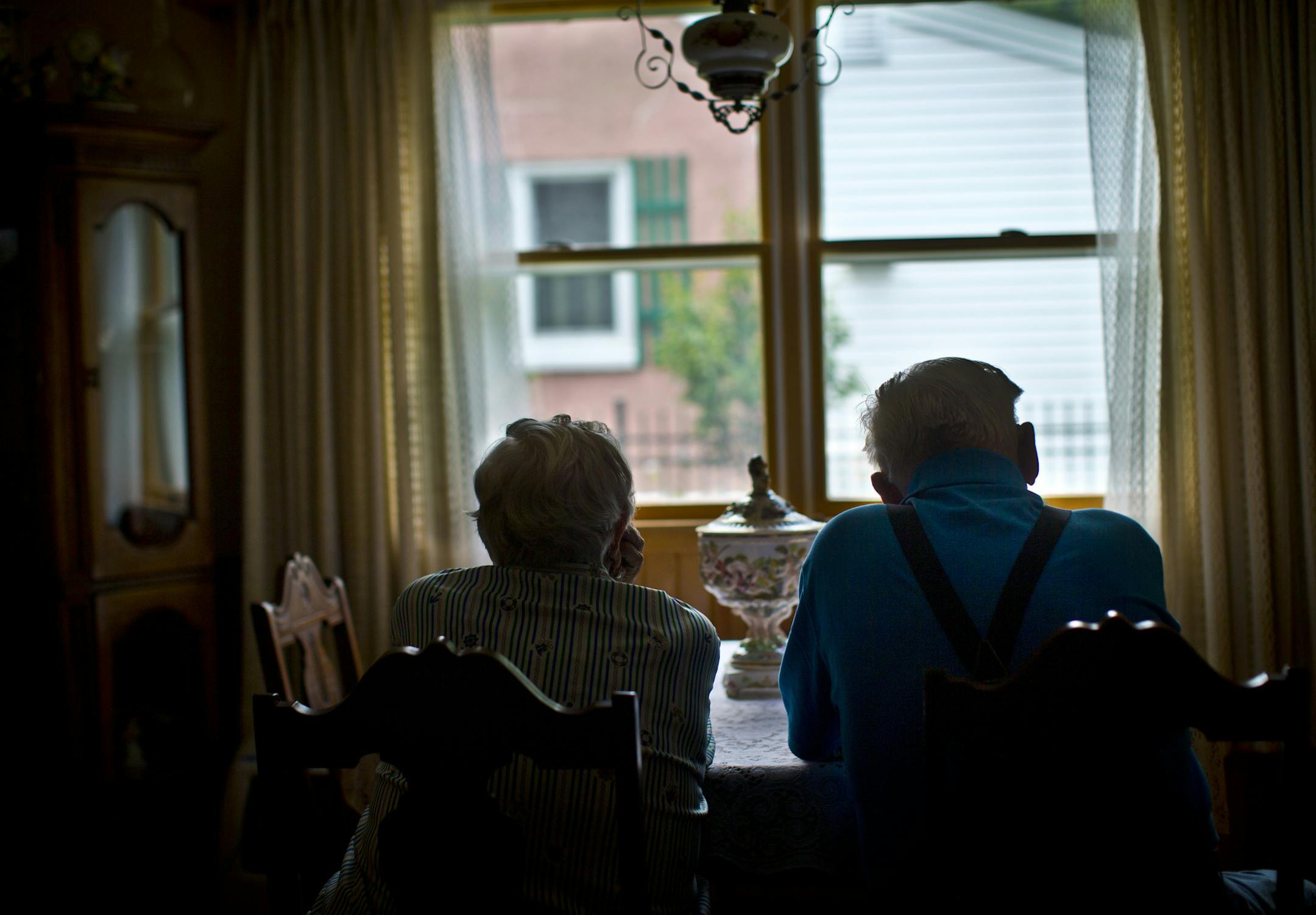 A Rochester woman has admitted that she bilked her elderly neighbors out of more than $800,000 with a sob story about having to go to Washington, D.C., to tend to her dead daughter's affairs and also to go to Italy for business purposes. The couple, who didn't want to be identified, looked out the picture window that faces that neighbor's house on Friday July 26, 2013 in Rochester, Minn. ] (RENEE JONES SCHNEIDER * reneejones@startribune.com)