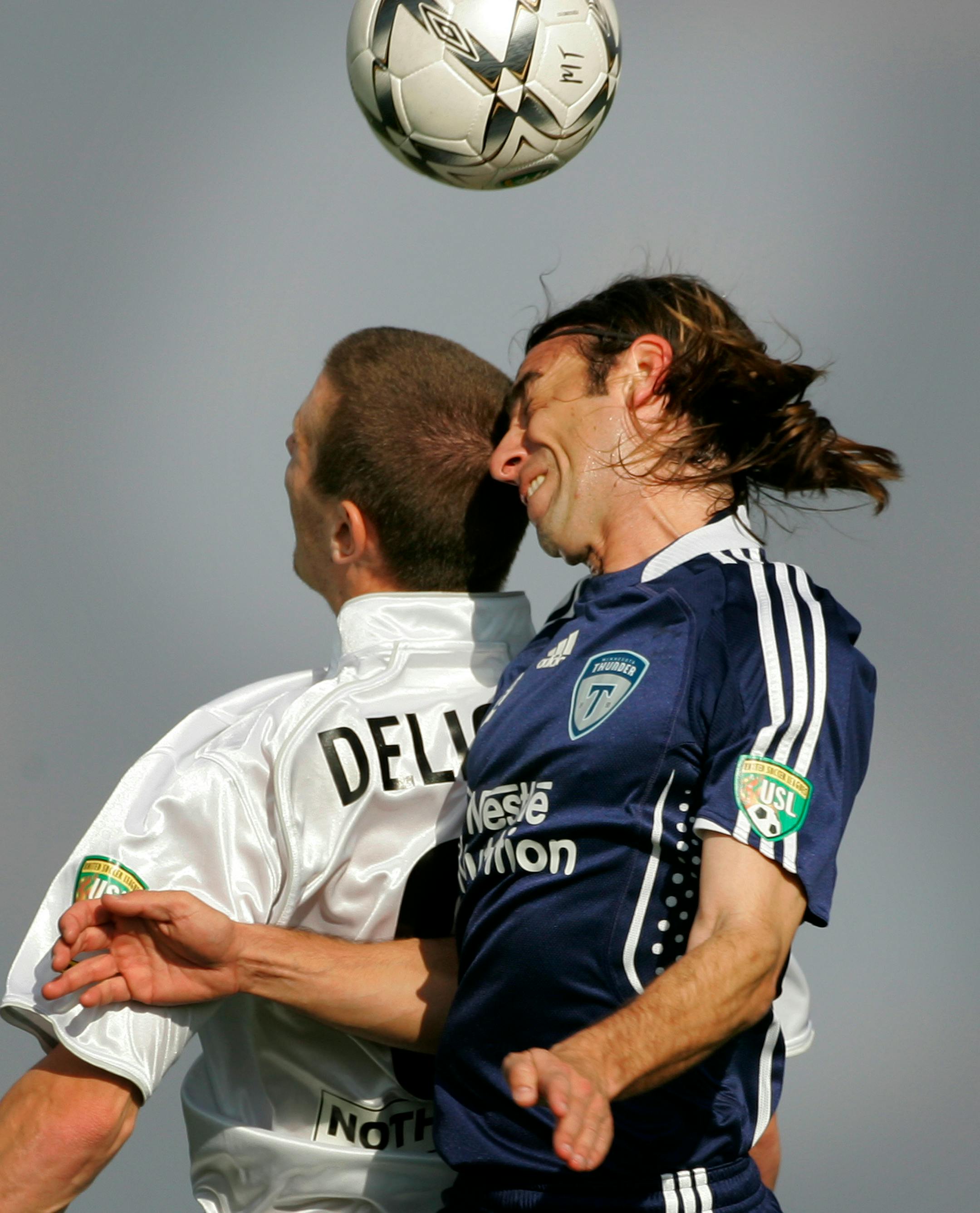 Minnesota Thunder's Kevin Freiedland (right) knocks heads with Rochester Rhinos' Matthew Delicate in the second half of the home opener for the Minnesota Thunder Soccer team at James Griffin Stadium in St. Paul Sunday night.
