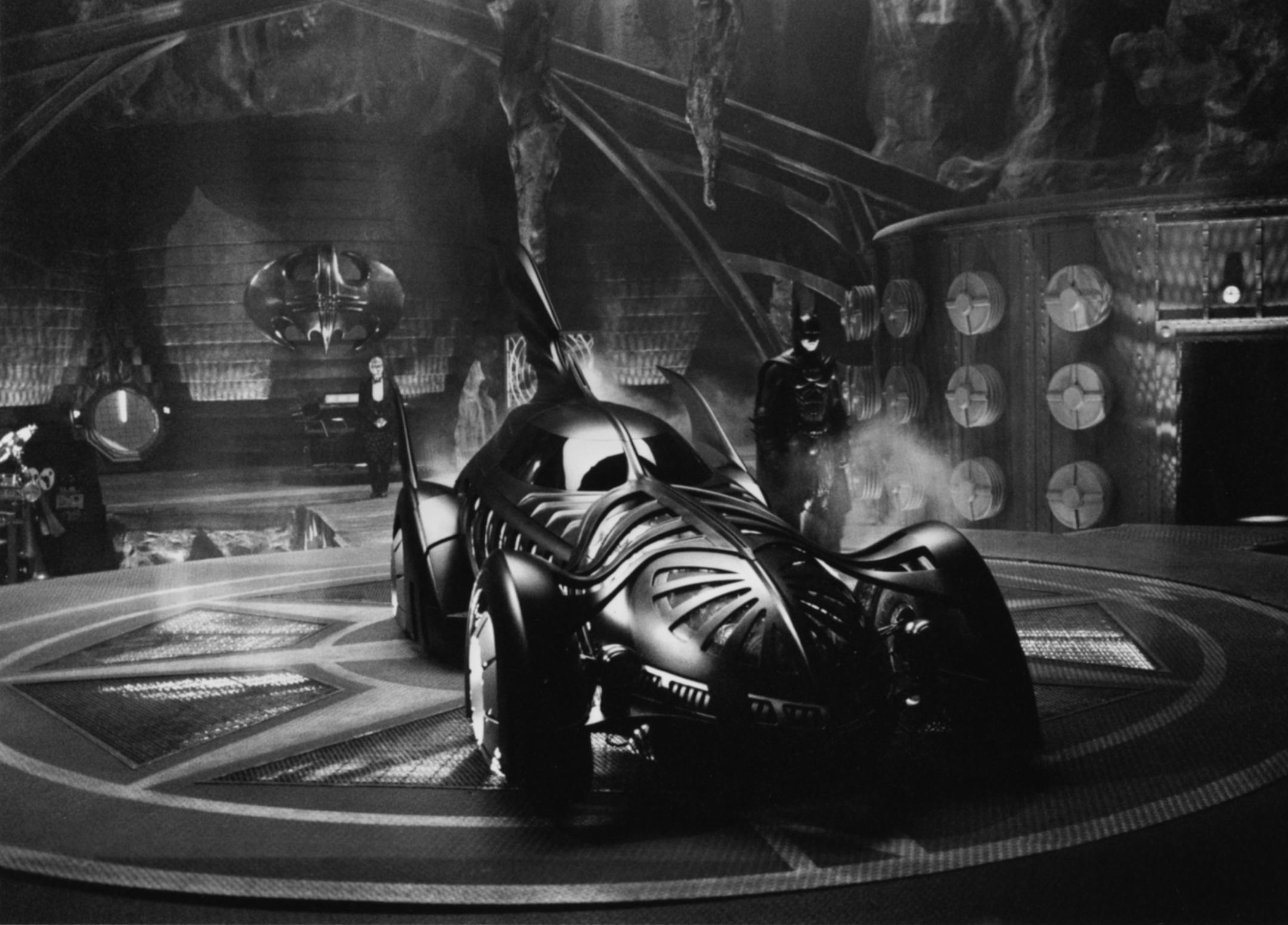 In "Batman Forever," Batman (Val Kilmer) prepares to take the Batmobile out to fight crime in Gotham City as his loyal butler, Alfred (played by Michael Gough) looks on. ORG XMIT: MIN2013040313190556