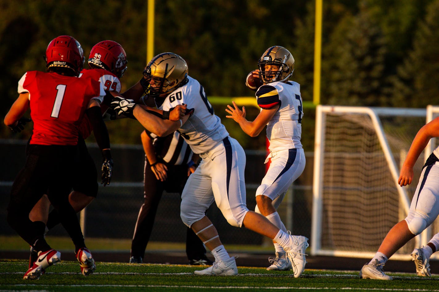 Chanhassen quarterback Brayden&nbsp;Windschitl&nbsp;(2) looks for an opening to pass in the first half of the opening night game between Elk River High School and Chanhassen High School Thursday, Aug. 31, 2023 at Elk River High School.