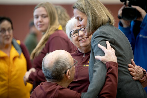 Dawn Plitzuweit, greeted by her family after introductory news conference as Gophers women’s basketball coach, got a guard from Wisconsin to sign wi