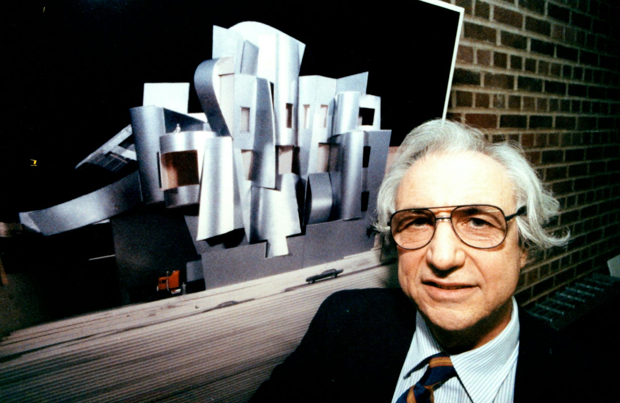 November 8, 1990 Showing of model and drawing of Frank Gehry U of M Art Museum new building.. Architect Frank Gehry stands class to a photographic model of New Art Museum building approved of by the Board of Regents today and to be completed in 1993... November 9, 1990 Richard Sennott, Minneapolis Star Tribune