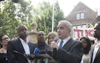 Minn. Gov. Mark Dayton speaks to protesters demonstrating the police shooting of Philando Castile Wednesday night, in front of the Governor's Residenc