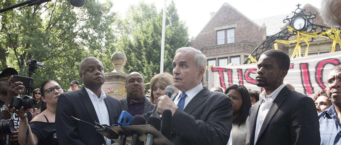 Minn. Gov. Mark Dayton speaks to protesters demonstrating the police shooting of Philando Castile Wednesday night, in front of the Governor's Residence in St. Paul, Minn., July 7, 2016. Dayton called on Thursday for a federal investigation into the shooting, which was at least the second killing this week of a black man by police officers, after the killing of a man in Baton Rouge during an attempted arrest. (Angela Jimenez/The New York Times) ORG XMIT: MIN2016071313112915