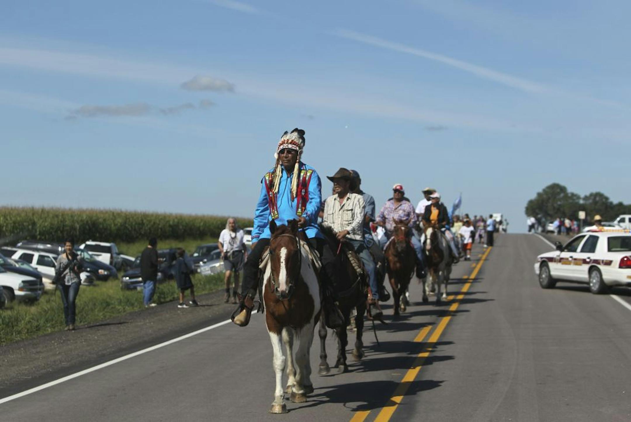 Elder Arvol Looking Horse led riders and walkers along Highway 30 near the end of the walk/ride Friday, Aug. 17, 2012, at the Minnesota/South Dakota border.