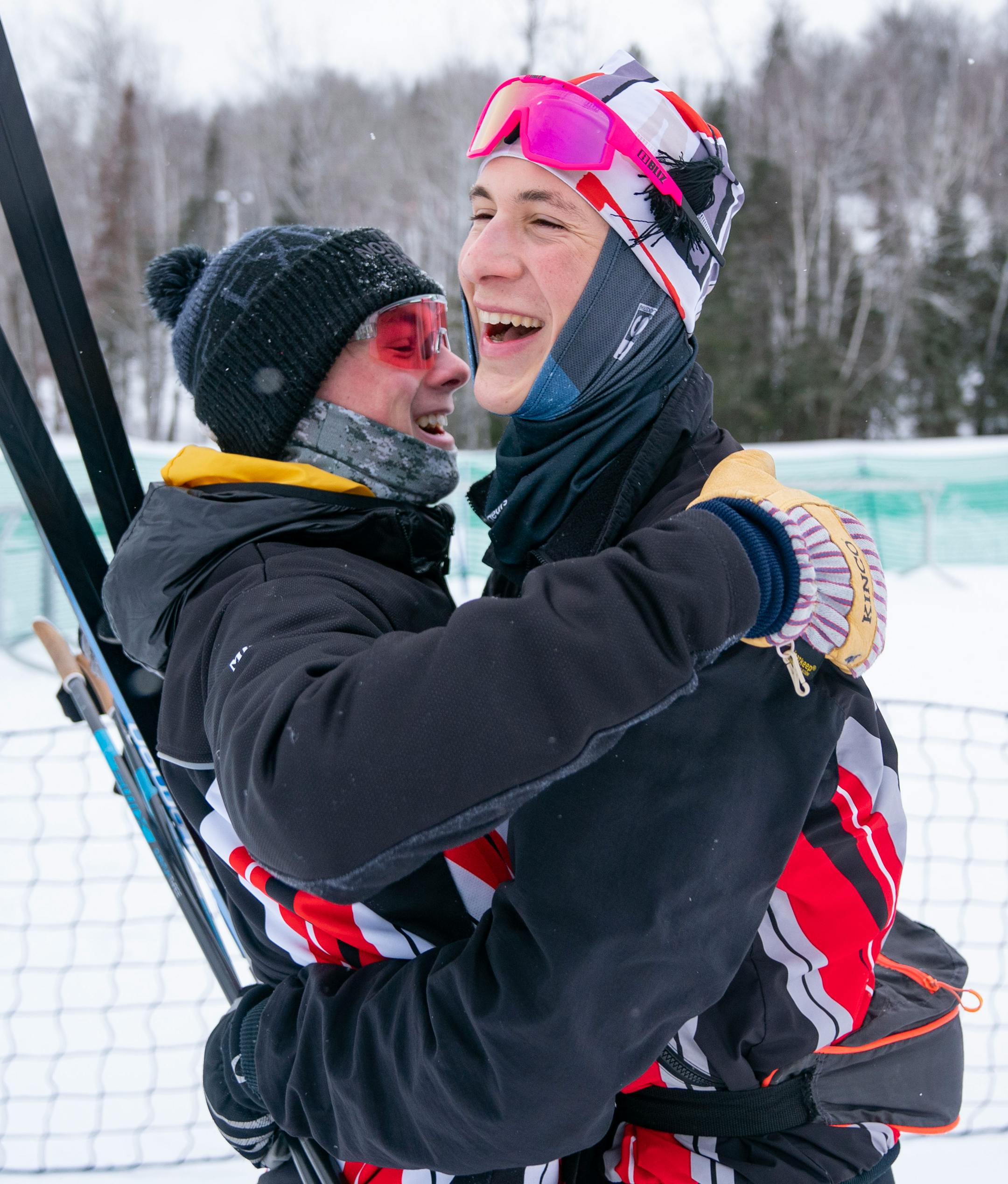 Duluth East nordic skier Oliver Miatke hugs his teammate, Colin Willemsen, after Willemsen took first place in the boy's team sprint final during the MSHSL Boys and Girls Nordic Ski Racing Meet.