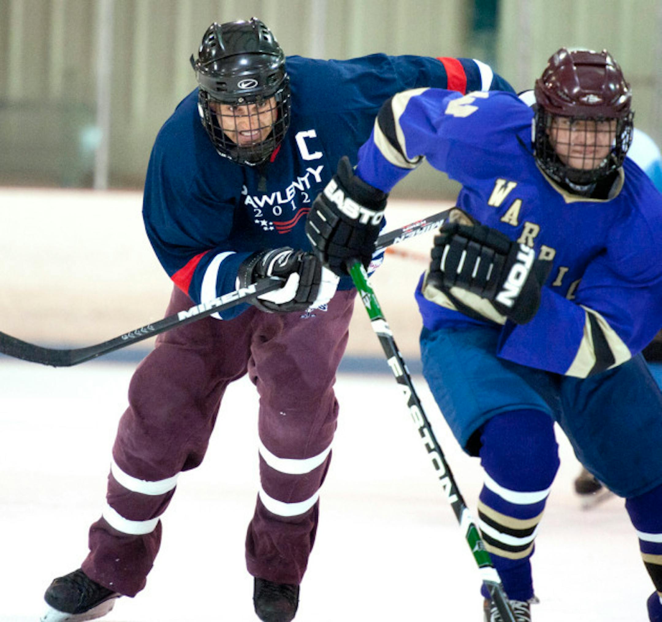 Tim Pawlenty put on skates and taped up his sweat pants for a game of hockey in Urbandale.  ]   GLEN STUBBE • gstubbe@startribune.com