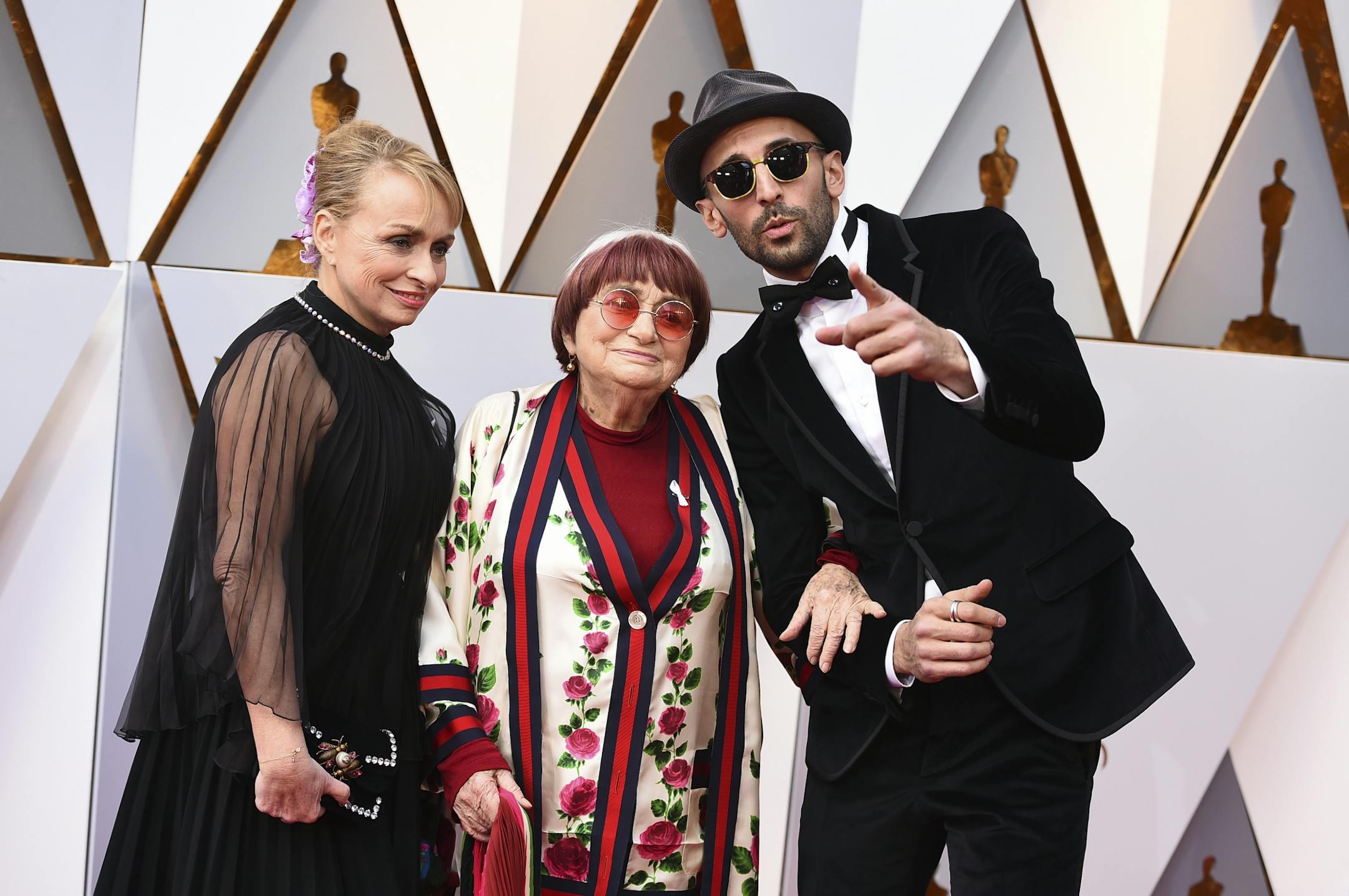 Rosalie Varda, from left, Agnes Varda, and JR arrive at the Oscars on Sunday, March 4, 2018, at the Dolby Theatre in Los Angeles.