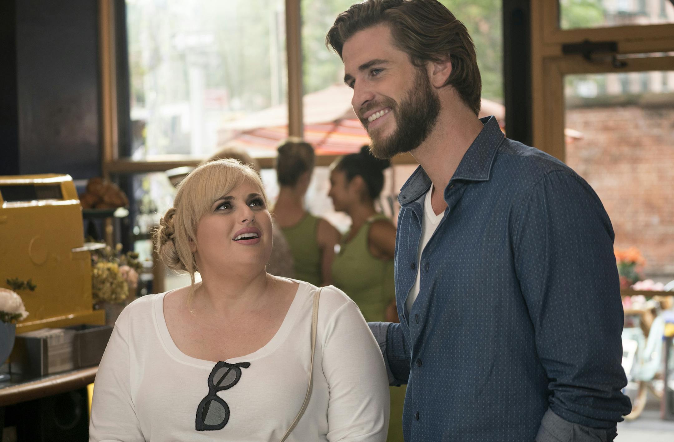 IIR-10862 Film Name: ISN'T IT ROMANTIC Copyright: &#xa9;2019 WARNER BROS. ENTERTAINMENT INC AND BRON CREATIVE USA, CORP. Photo Credit: Michael Parmelee Caption: (L-R) REBEL WILSON as Natalie and LIAM HEMSWORTH as Blake in New Line Cinema's comedy "ISN'T IT ROMANTIC," a Warner Bros. Pictures release.