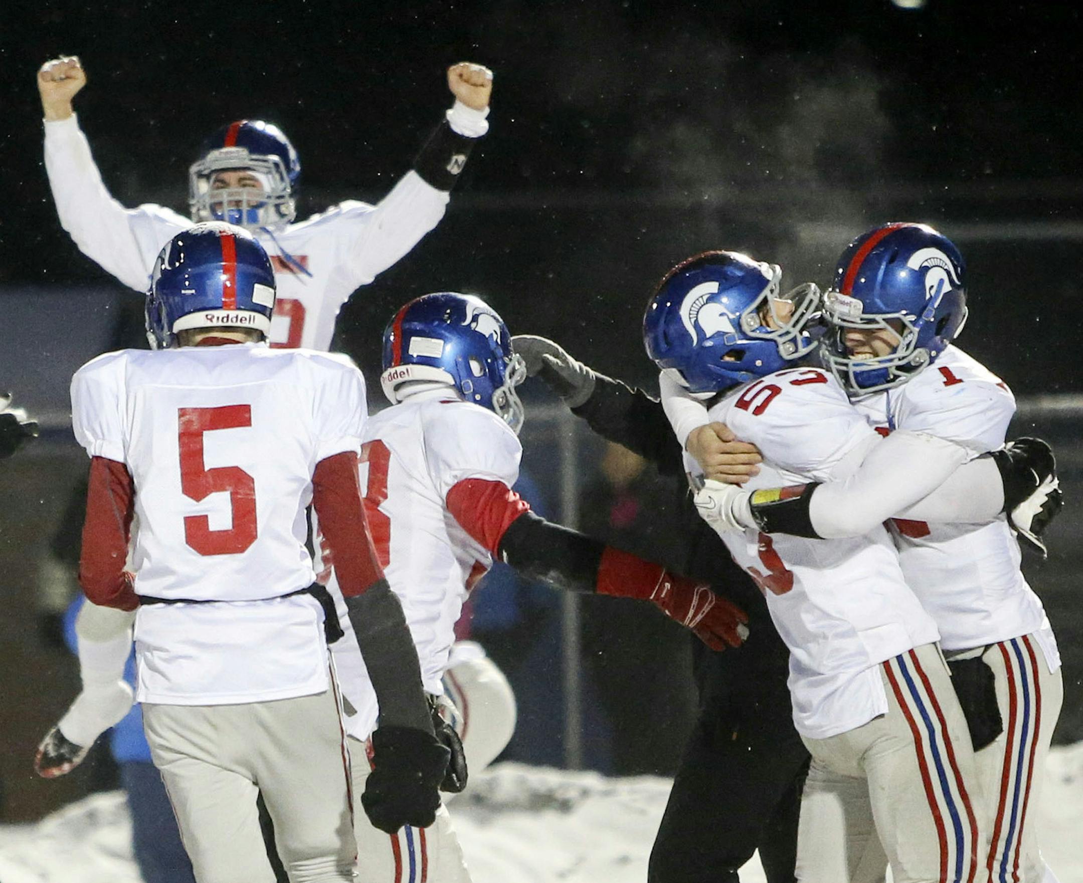 Players celebrated after Simley's 21-14 playoff win over Spring Lake Park on Saturday. It put the Spartans in the Prep Bowl.