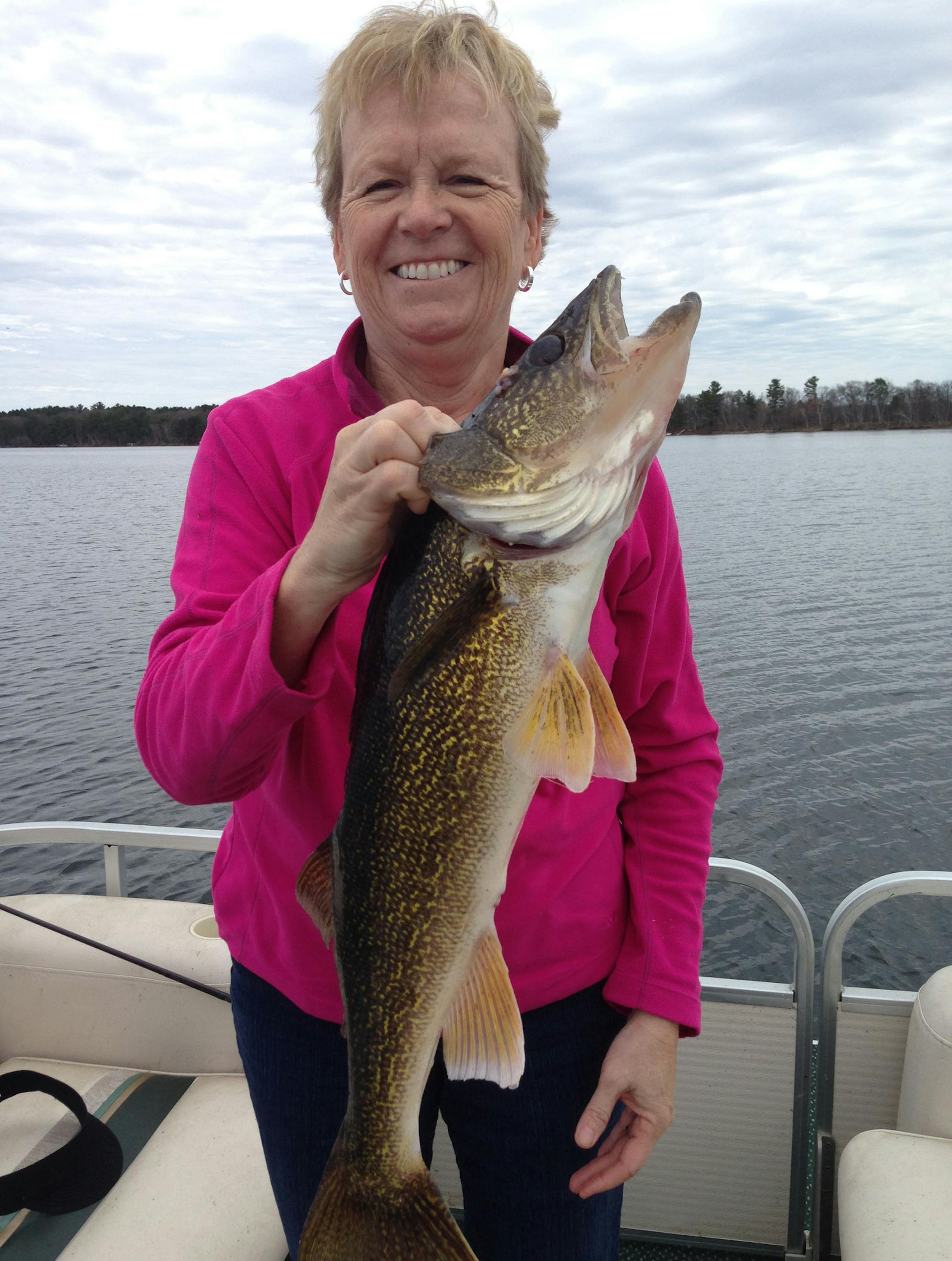 Sue Hough of Plymoth with her first-ever walleye, a 27-incher, caught in Lake Hubert near Brainerd.