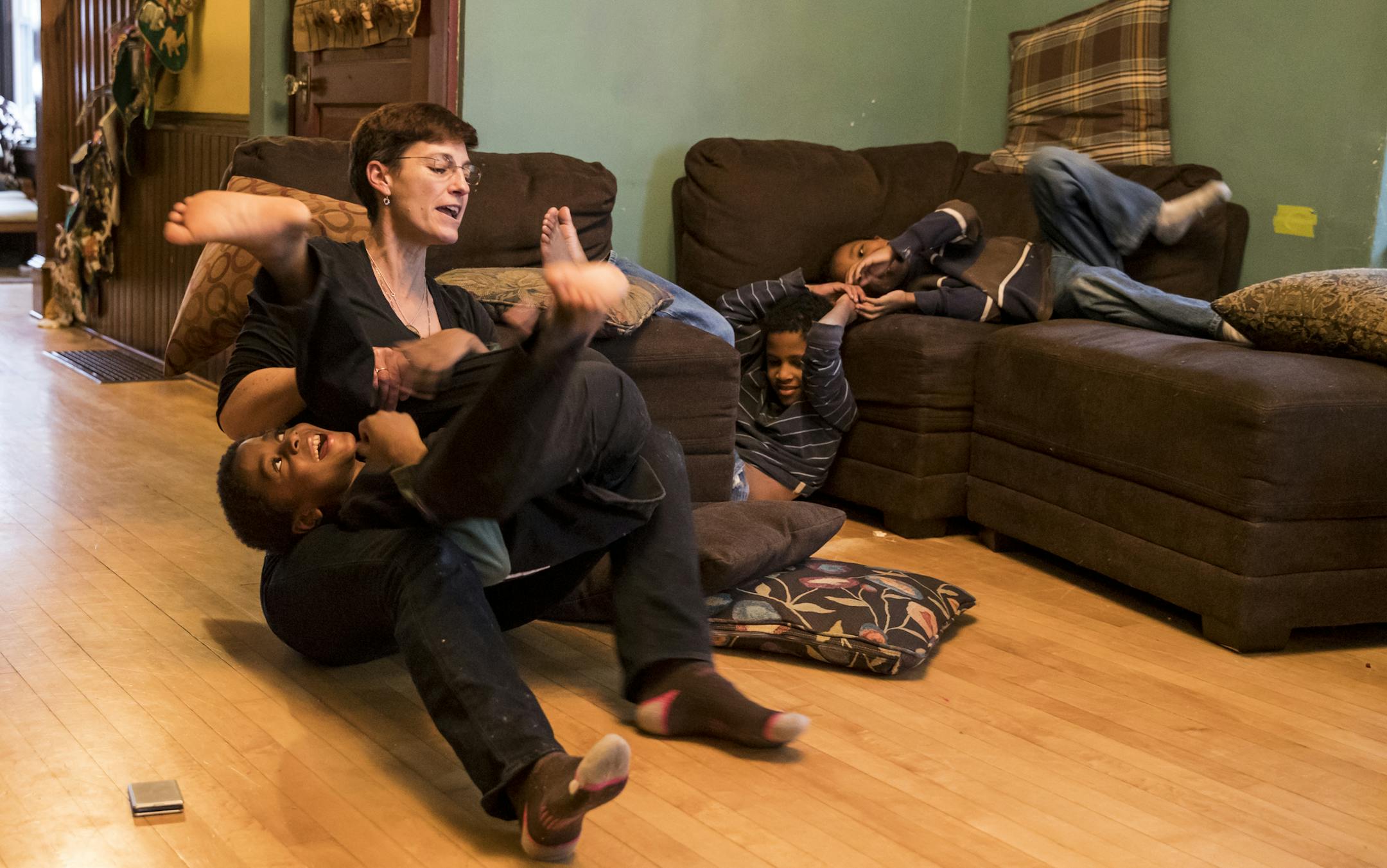 Dorothy Bode playfully wrestled with her sons in the living room after school on Friday, December 16, 2016, in Minneapolis, Minn. Bode has 11 children, 8 which were adopted. ] RENEE JONES SCHNEIDER • renee.jones@startribune.com