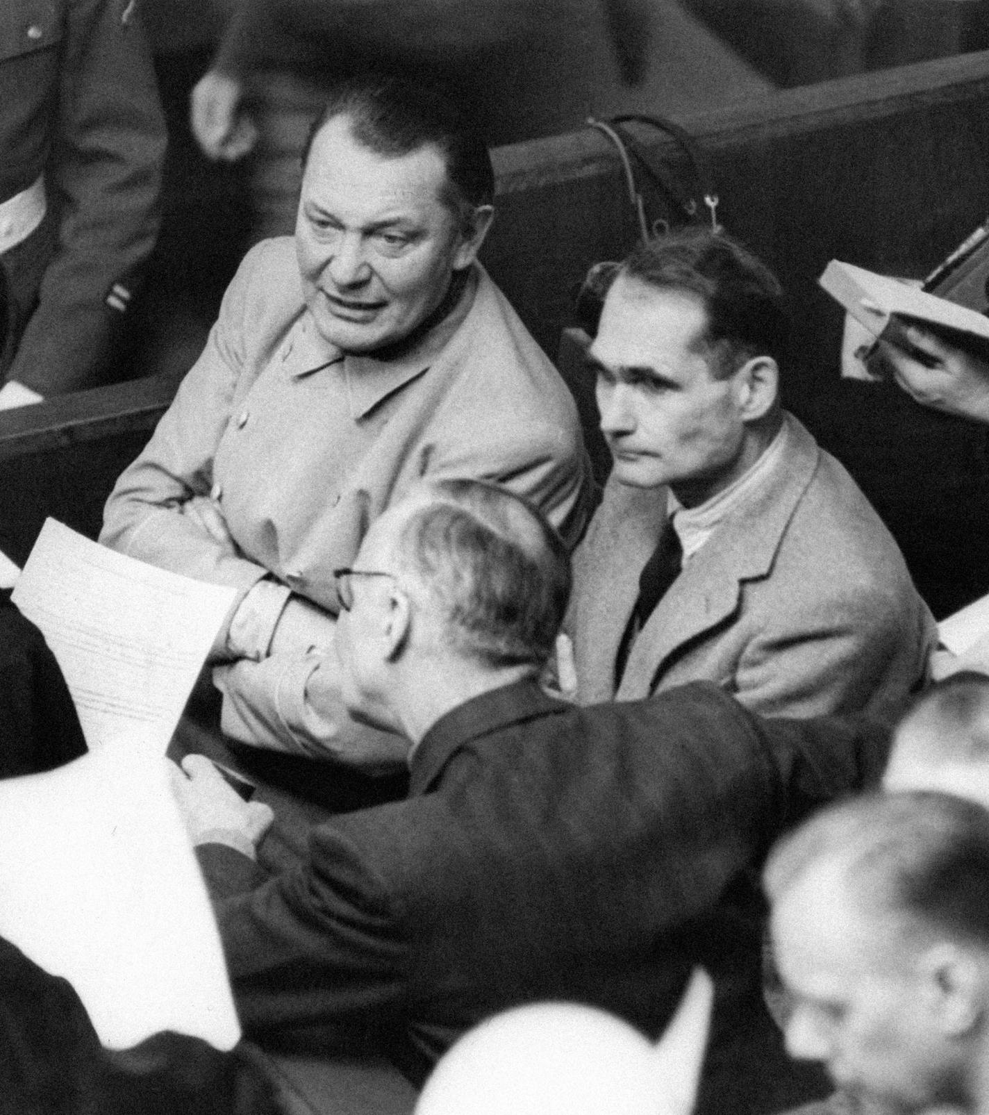 Rudolf Hess has asked permission of the international military tribunal to be allowed to act as his own attorney &#x201c;from now until the end of the trial.&#x201d; He is discussing his application during a recess in the Nuremberg trial, with Goering, Ribbentrop and two lawyers on Jan. 28, 1946. Goering appears to be taking a keen interest in the proceedings. (AP Photo)