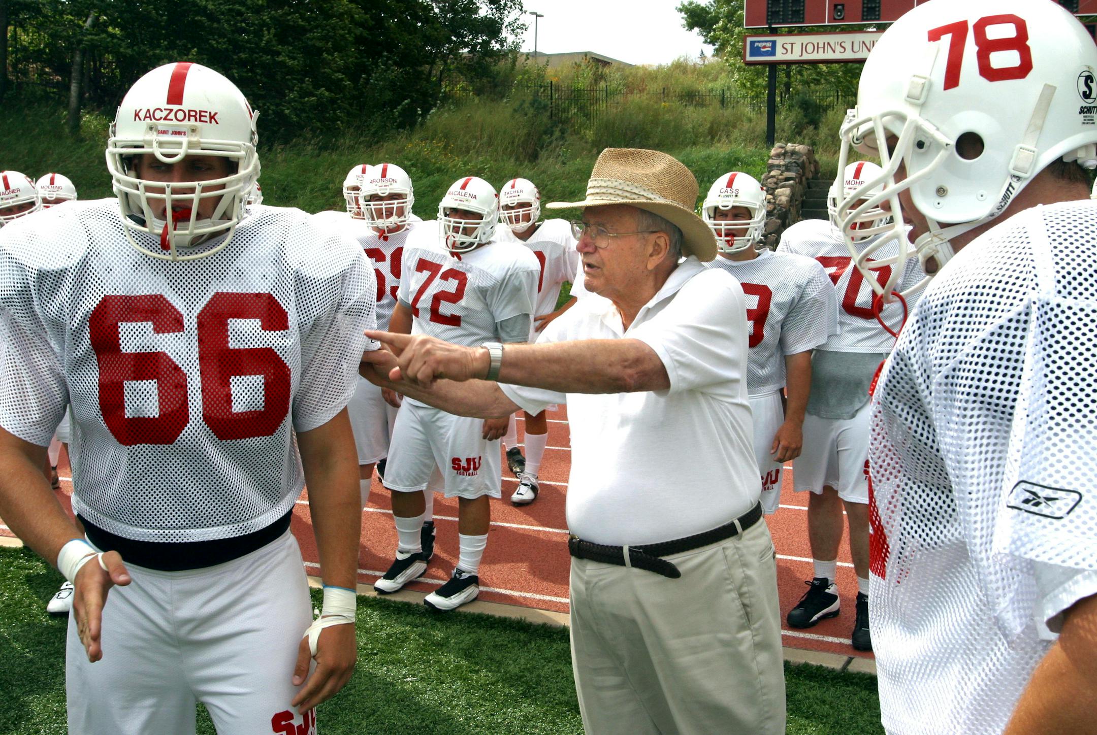 John Gagliardi provided some hands-on instruction to his players in August of 2003.