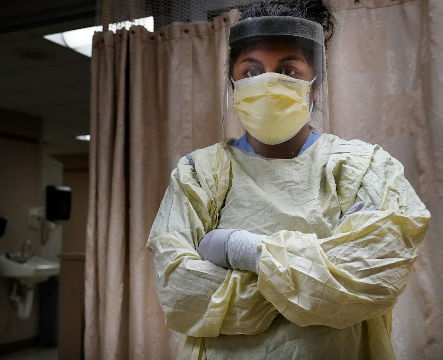 Nurse practitioner Sheyanga Beecher posed for a portrait in her PPE Tuesday at HCMC in Minneapolis.