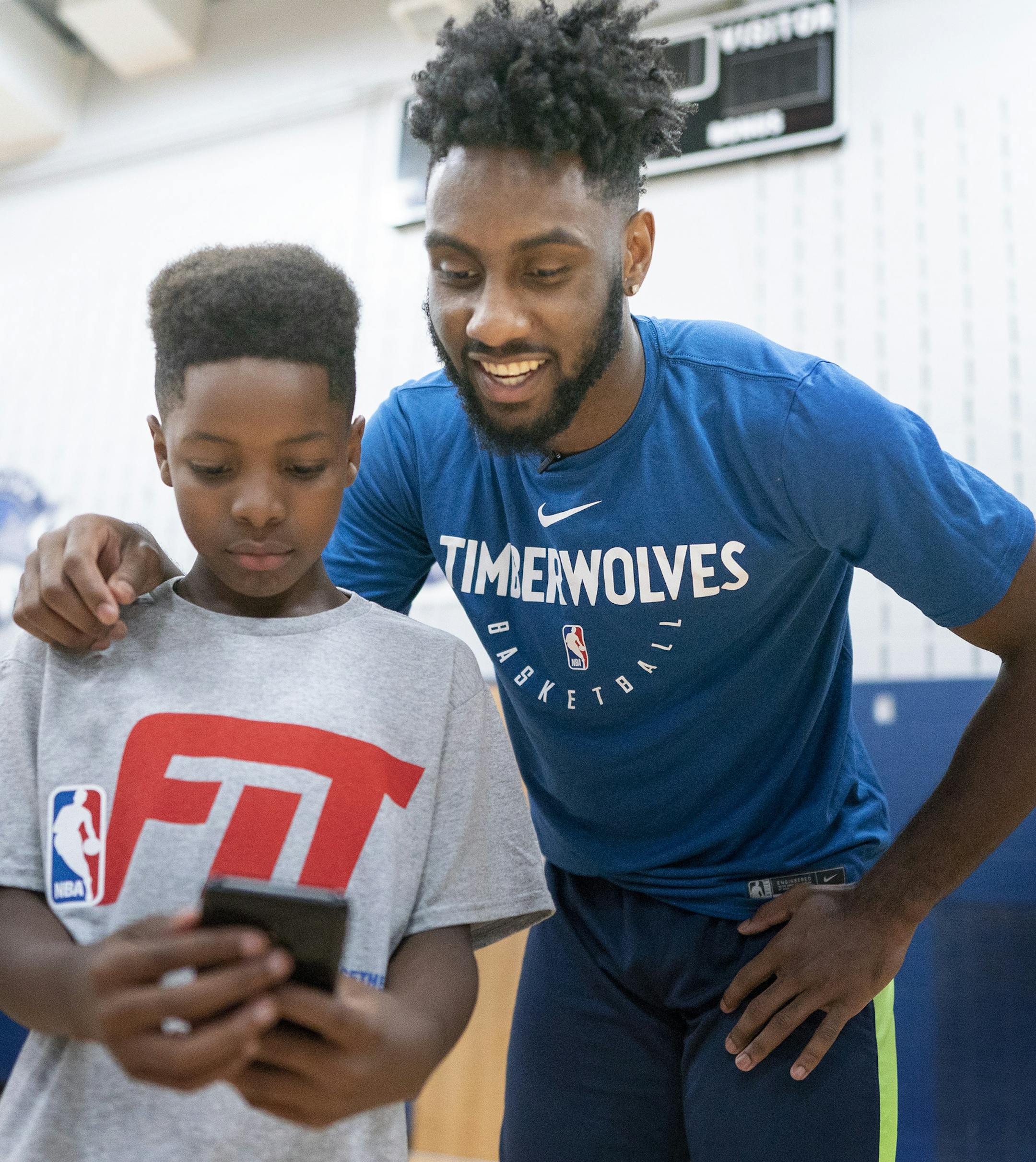 Danny Stamps 10, took a photograph with Wolves draft pick Jaylen Nowell looked on during a clinic at Conway Community Center July,18 2019 in St Paul, MN.] Jerry Holt • Jerry.holt@startribune.com