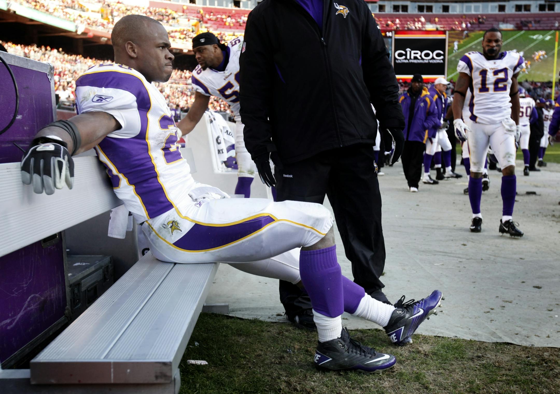 Minnesota Vikings running back Adrian Peterson (28) sat on the bench after he left the Washington game with his knee injury.
