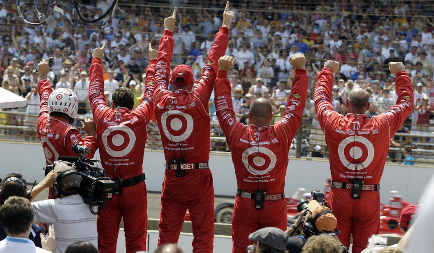 Crew members for Dario Franchitti, of Scotland, celebrate as he wins IndyCar's Indianapolis 500 auto race at Indianapolis Motor Speedway in Indianapolis, Sunday, May 27, 2012. (AP Photo/Darron Cummings)