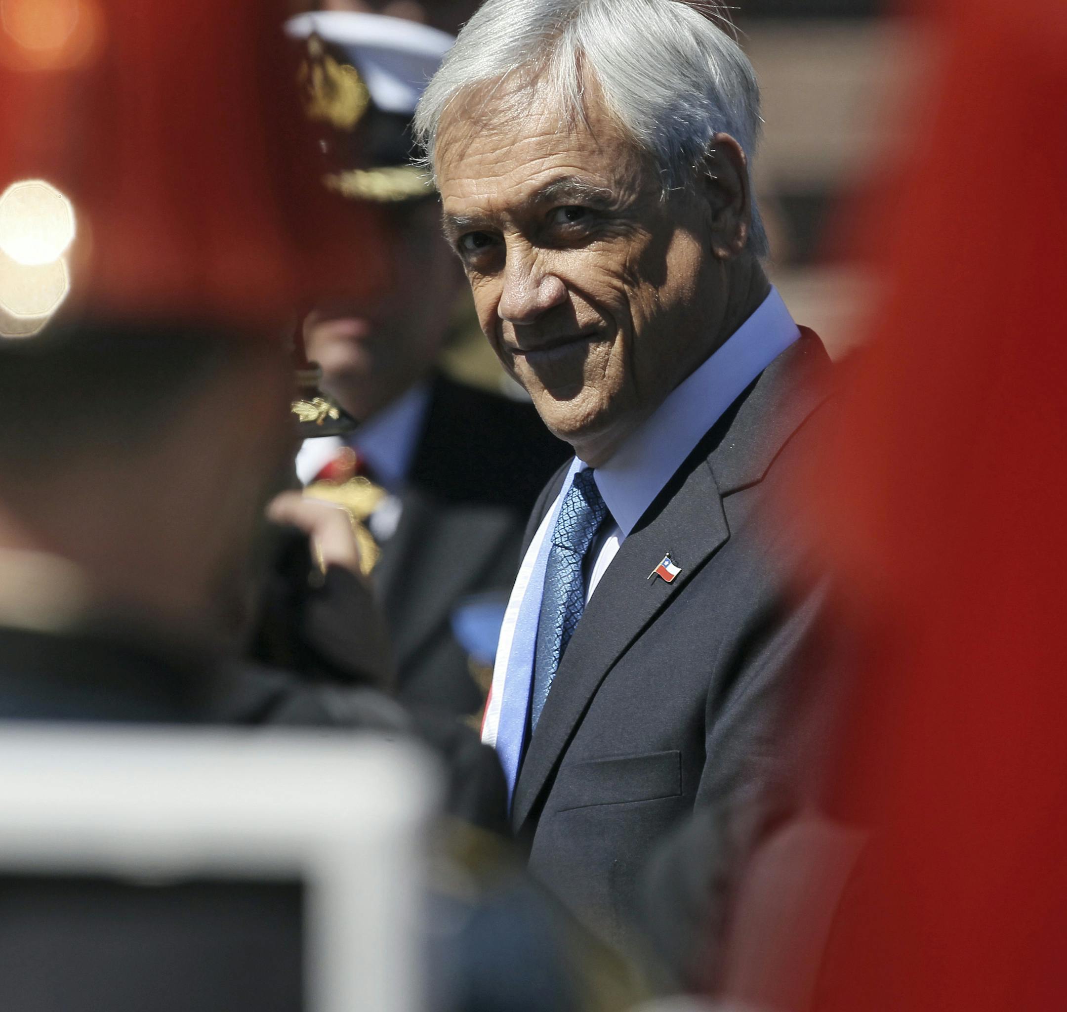 Chile's newly inaugurated President Sebastian Pinera leaves Congress after his swearing-in ceremony in Valparaiso, Chile, Sunday, March 11, 2018. Pinera returned to Chile's presidency after his first term from 2010 to 2014. (AP Photo/Luis Hidalgo) ORG XMIT: XLHP110