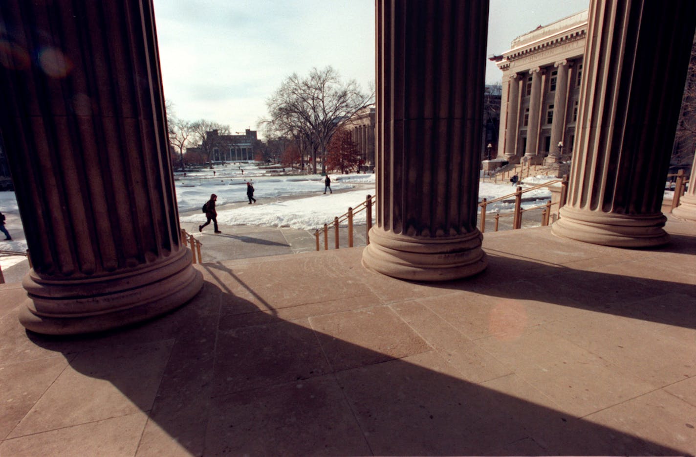 GENERAL INFORMATION: From its internationally reknowned bone marrow transplant team to its General College the University of Minnesota tries to meet the needs of a variant population.
IN THIS PHOTO: Minneapolis, Mn., Fri., Feb. 2, 2001--The pillars of Northrop Auditorium frame the mall of the University of Minnesota East Bank campus. At right is Johnston Hall.