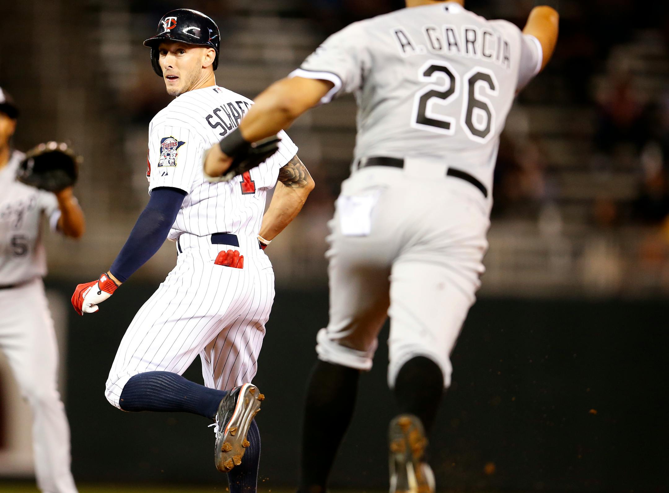 Jordan Schafer (1) was caught in a rundown in the seventh inning.