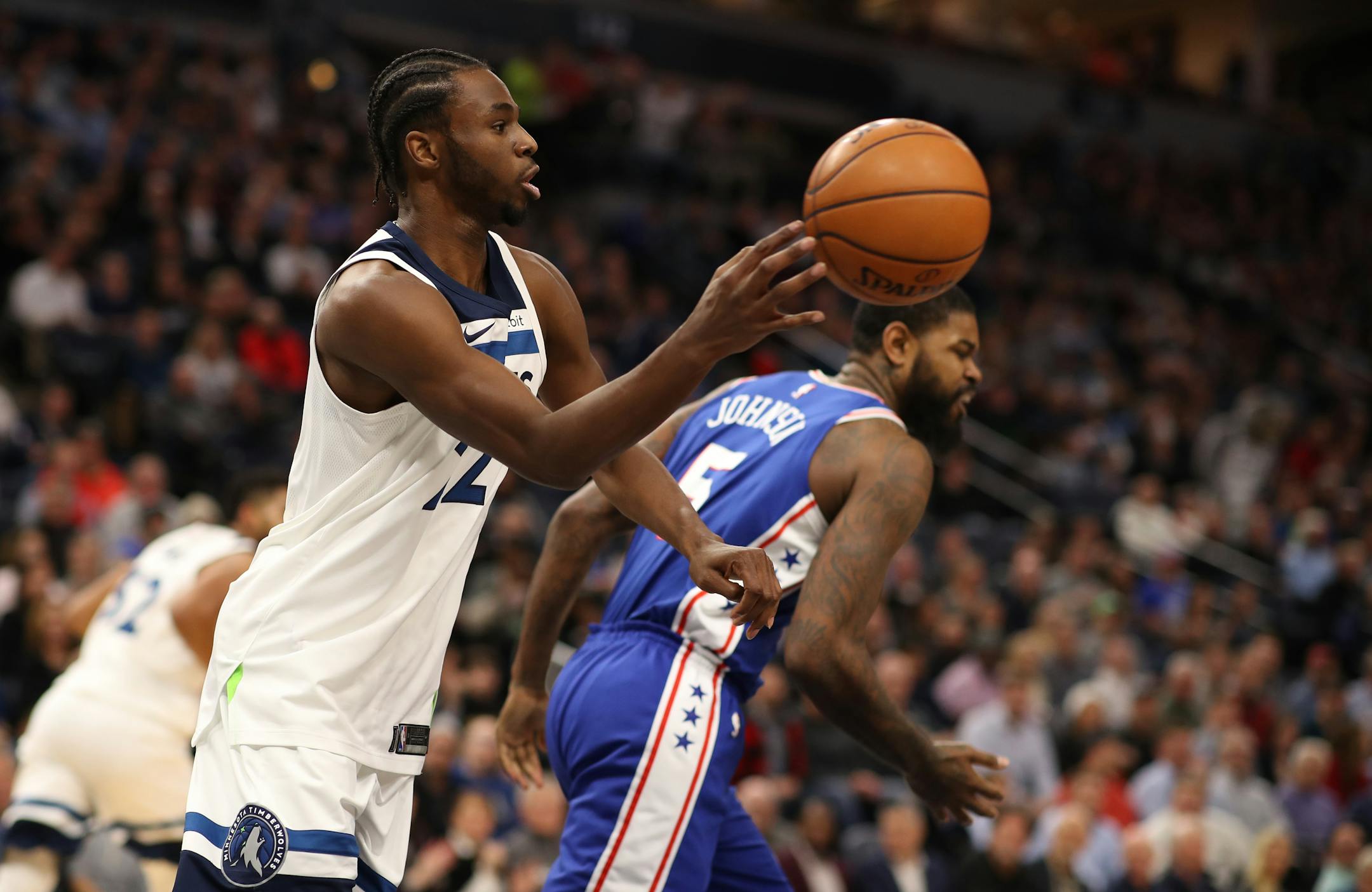 Minnesota Timberwolves forward Andrew Wiggins (22) passed down ball down court over Philadelphia 76ers forward Amir Johnson (5) during NBA action at Target Center Tuesday December 12, 2017 in Minneapolis, MN.] The Minnesota Timberwolves hosted the Philadelphia 76ers at Target Center. JERRY HOLT � jerry.holt@startribune.com