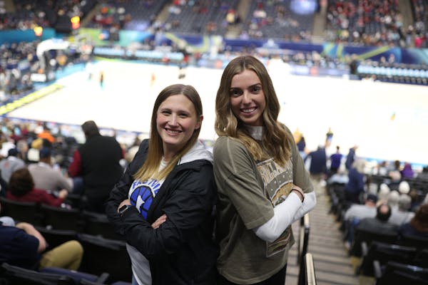Megan Walstad, right, Miss Basketball for Eastview in 2018, and her coach Molly Kasper attended Sunday's championship game at Target Center