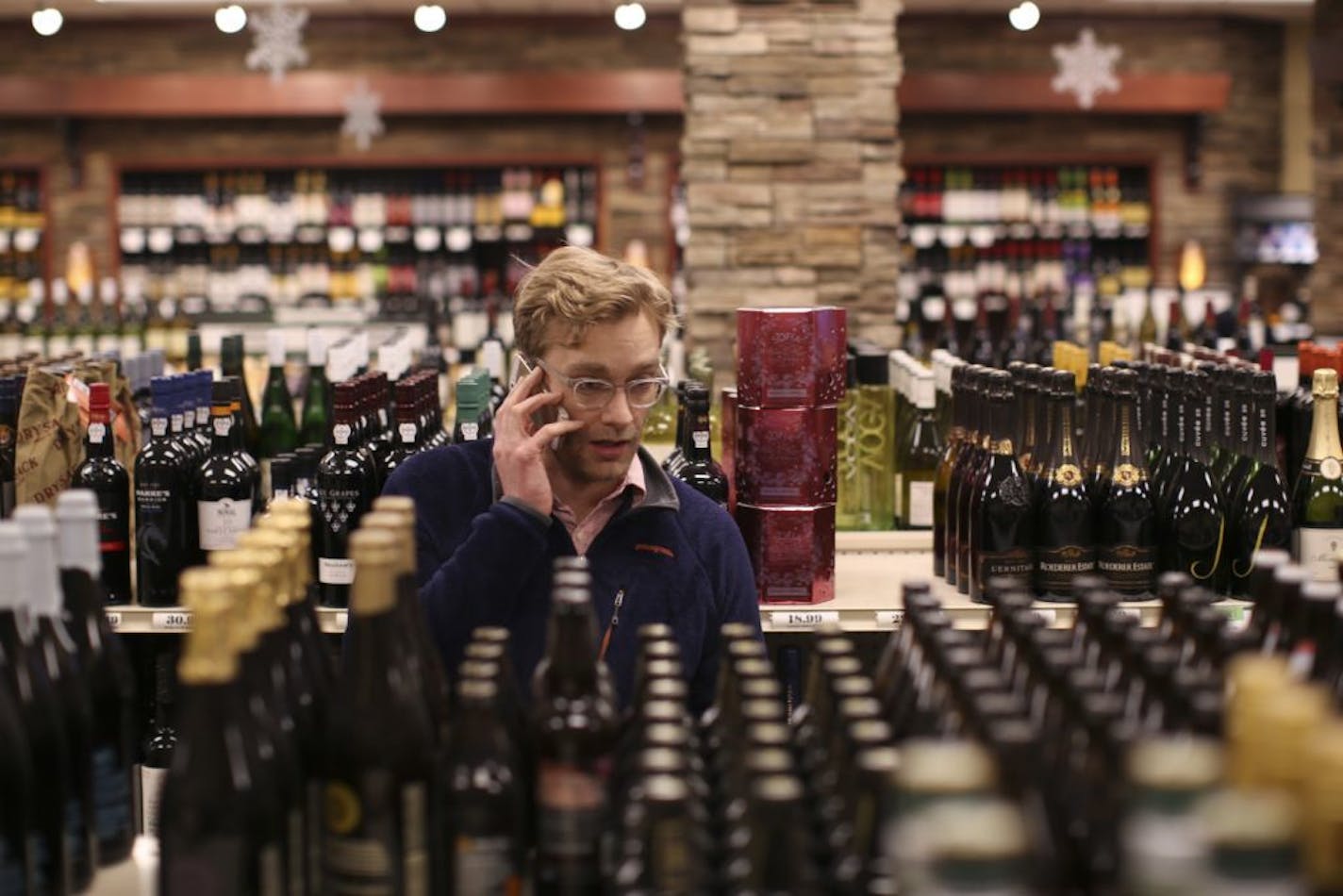 Jesse Martin picked up some beer for New Year's Eve in the Edina Liquor store at 50th & France Wednesday afternoon.