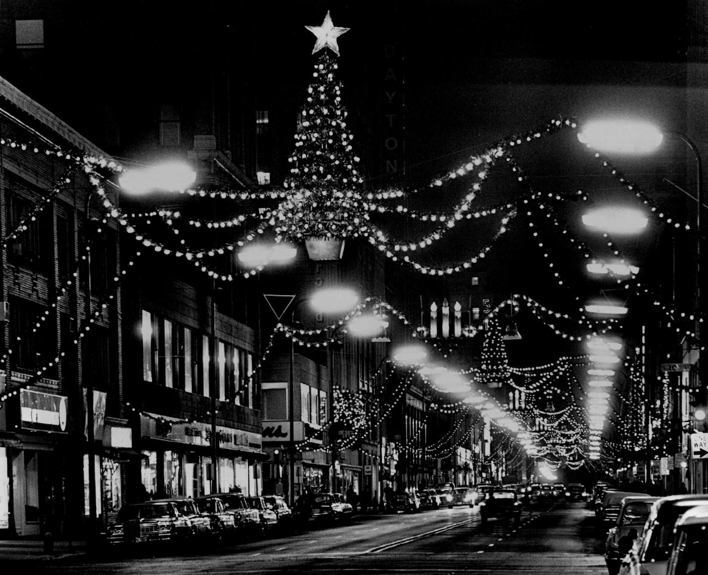 November 25, 1964 Christmas Lights Christmas decorations along Nicollet Av., are ready for the season. All buildings in the downtown area will turn on their lights from 5:30 to 9:30 p.m. Monday during light-up night. Eight buildings will be completely outlined with yellow lights. Participating will be: Cargill Building, Farmers and Mechanics Savings Bank, First National Bank, Investor's Building, North Star Center, Northern States Power Roanoke Building and Young-Quinlan-Rothschild's. November 24, 1964 Jack Gillis, Minneapolis Star Tribune