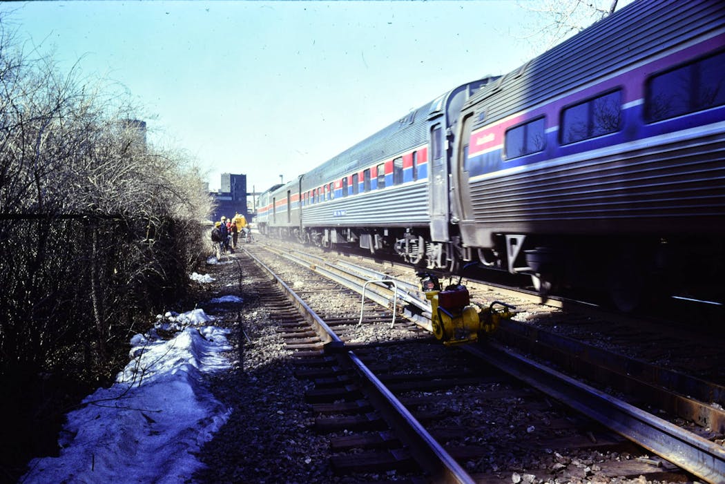 An Amtrak train crosses the Stone Arch Bridge in the 1970s. The last passenger rail crossed the bridge in 1978.