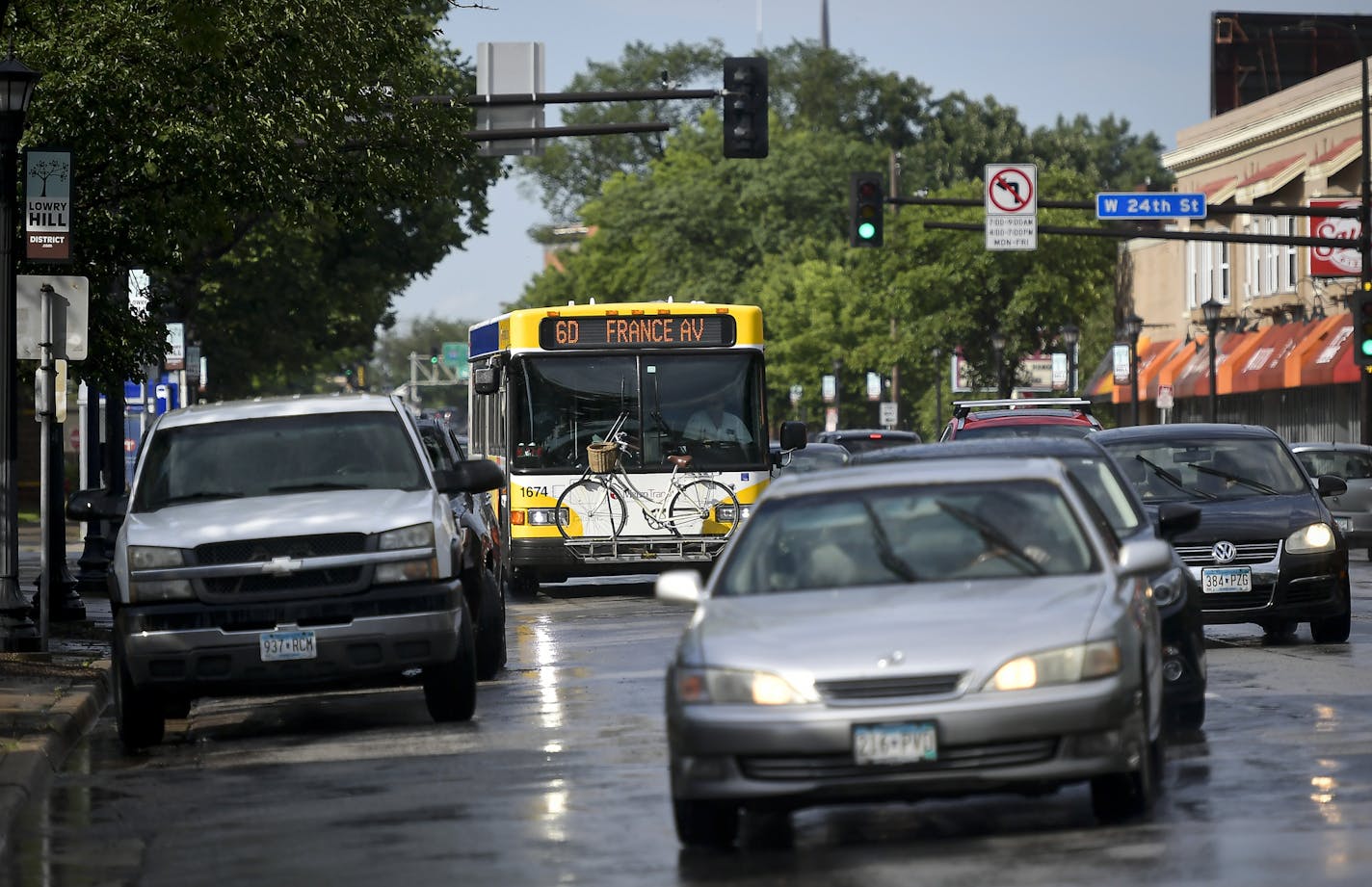 Traffic moved along Hennepin Avenue near West 24th Street during the evening commute.