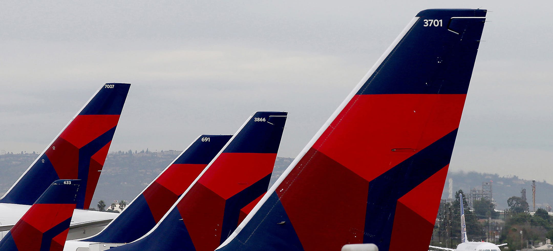 Delta Airlines aircraft are lined up at Terminal 5 in Los Angeles International Airport on December 21, 2016. (Luis Sinco/Los Angeles Times/TNS) ORG XMIT: 1353214