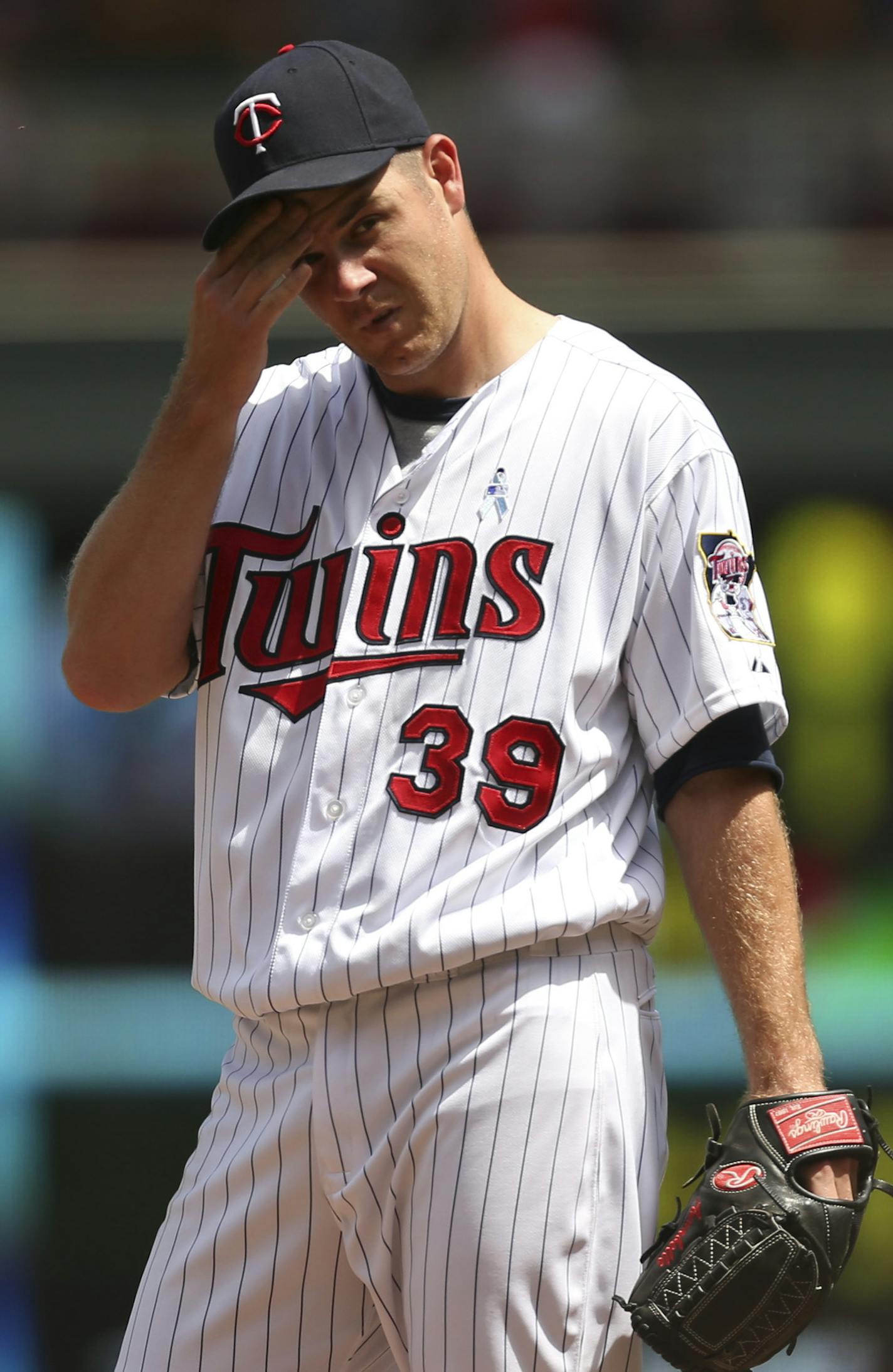 The MInnesota Twins closed out a series against the Detroit Tigers with a 5-2 loss Sunday afternoon, June 16, 2013 at Target Field in Minneapolis. With two Tigers on base, Twins starting pitcher P.J. Walters looked up in the sixth inning to see manager Ron Gardenhire coming to the mound to yank him out of the game. He allowed two run homers to Torii Hunter and Austin Jackson in the game. ] JEFF WHEELER &#x201a;&#xc4;&#xa2; jeff.wheeler@startribune.com