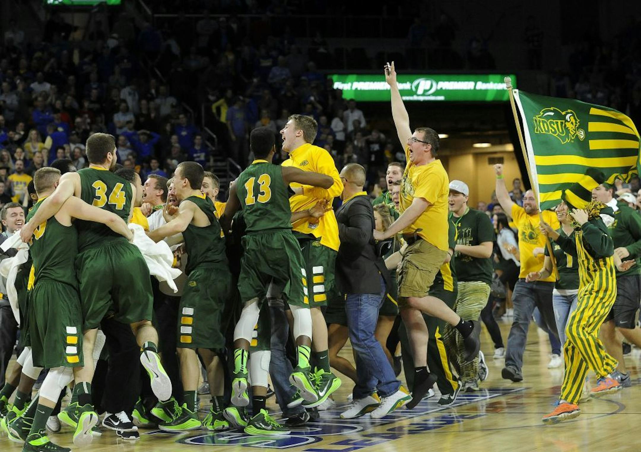 North Dakota State celebrates after an NCAA college basketball game against South Dakota State for the Summit League tournament title, Tuesday, March 10, 2015, in Sioux Falls, S.D. North Dakota State won 57-56.