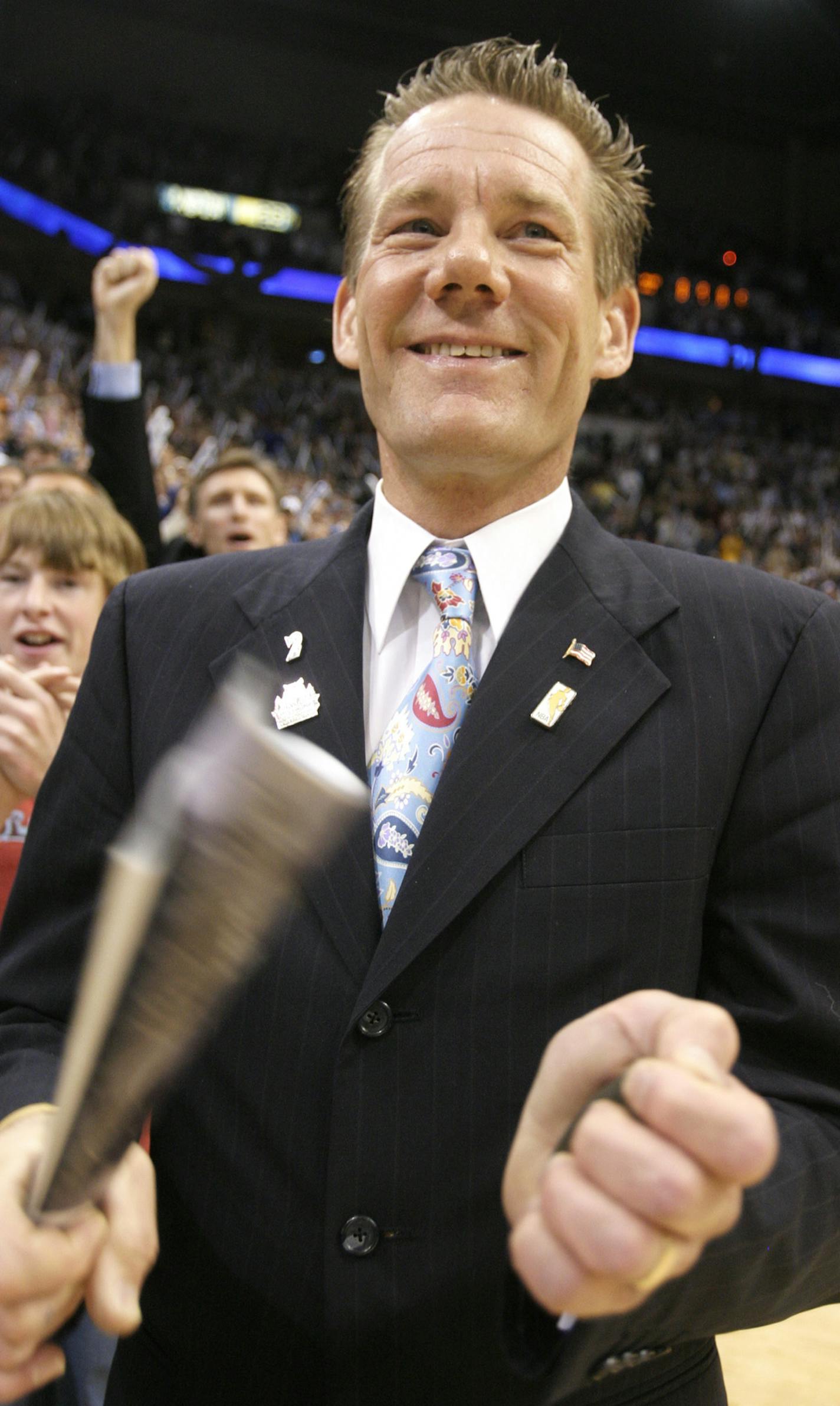 Minneapolis, MN;5/4/04;left to right:At the Target Center, superfan Bill Beise has a courtside seat. He roots on the Wolves with a rolled up magazine in hand
GENERAL INFORMATION: Wolves Supporters