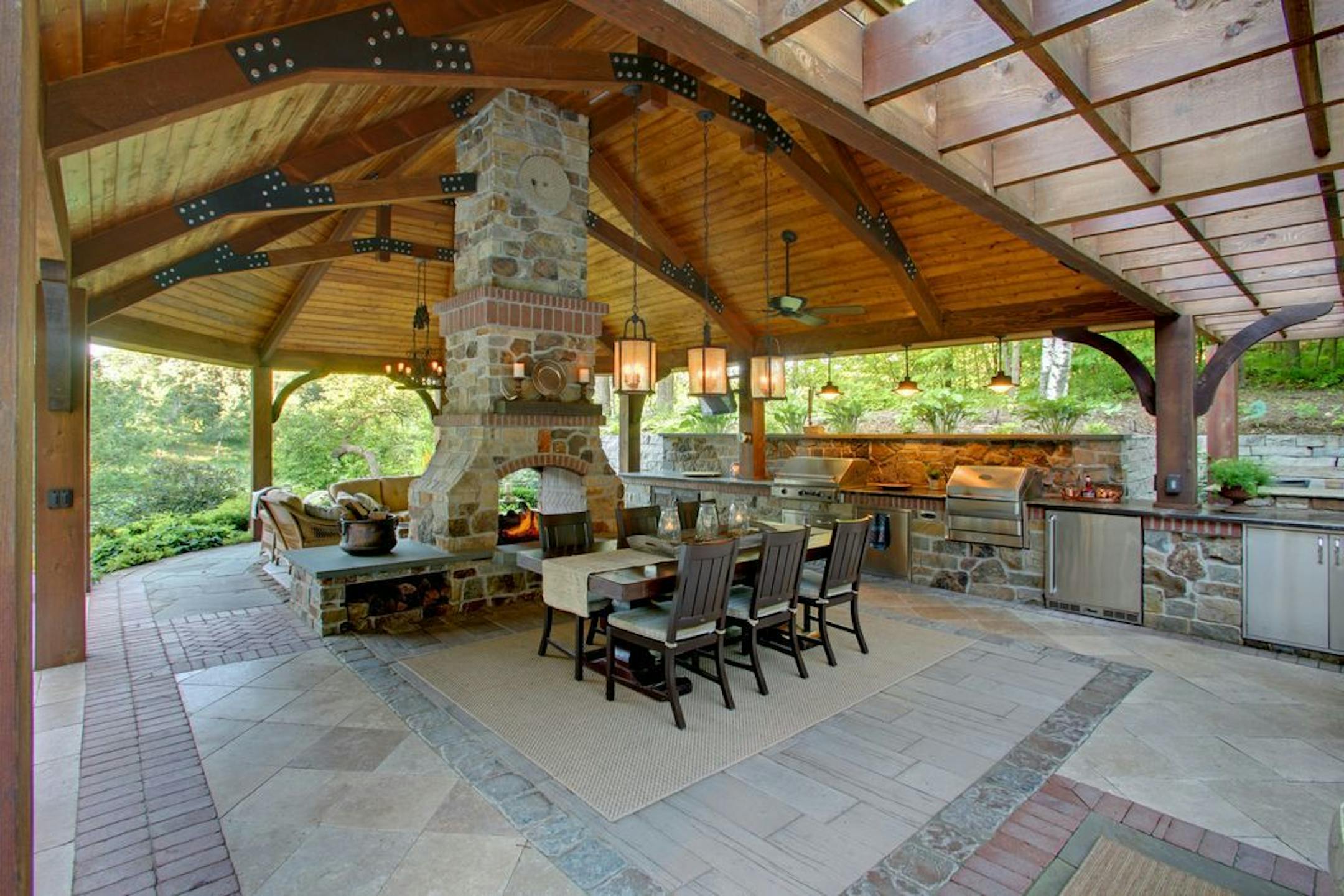 A stone border defines the dining area of the stamped concrete floor.