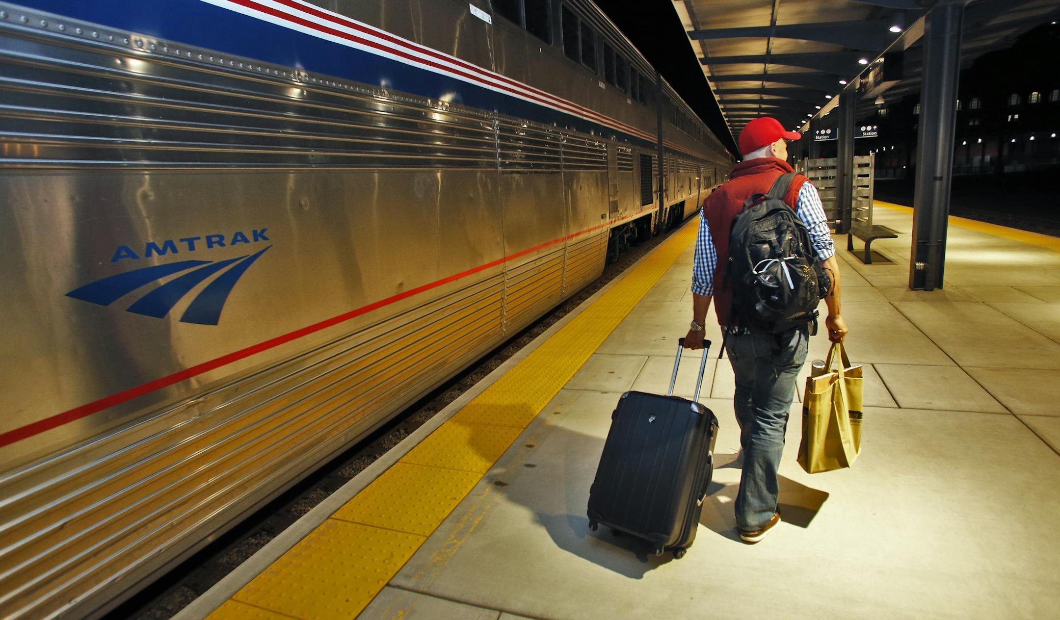Tim Pomaville of Chicago was the first passenger to step foot on the St. Paul Union Depot platform. ] The first train to pull in to downtown St. Paul in forty years arrived at the newly renovated Union Depot - an Amtrak arrival from Chicago. . (MARLIN LEVISON/STARTRIBUNE(mlevison@startribune.com)