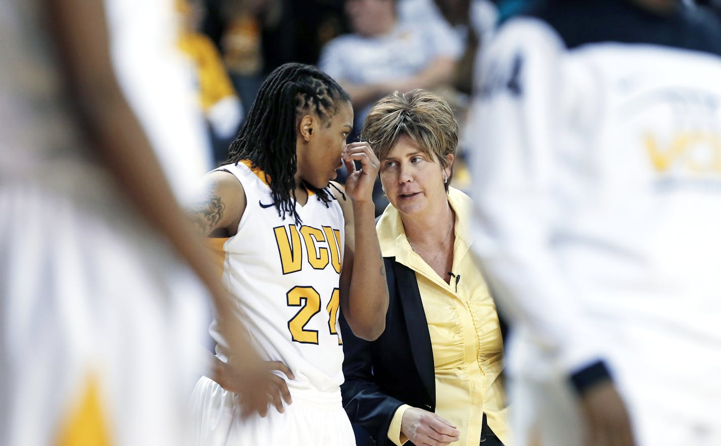 VCU head coach Marlene Stollings talks to Robyn Parks during a timeout as they play St. Joseph's at the Siegel Center Sunday, January 12, 2014. ORG XMIT: RIC1401122128002299