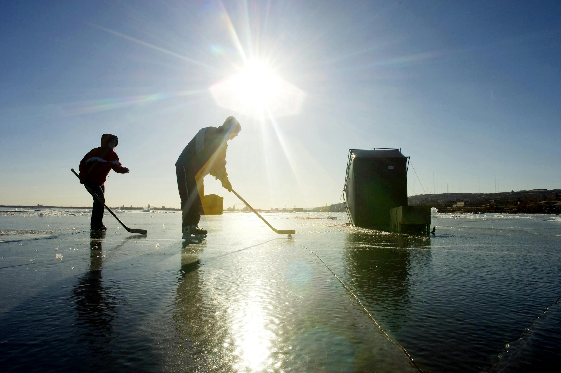 If the fish aren't biting, there are other things to do -- like playing hocikey on smooth, snowless ice on Lake Superior near Duluth.