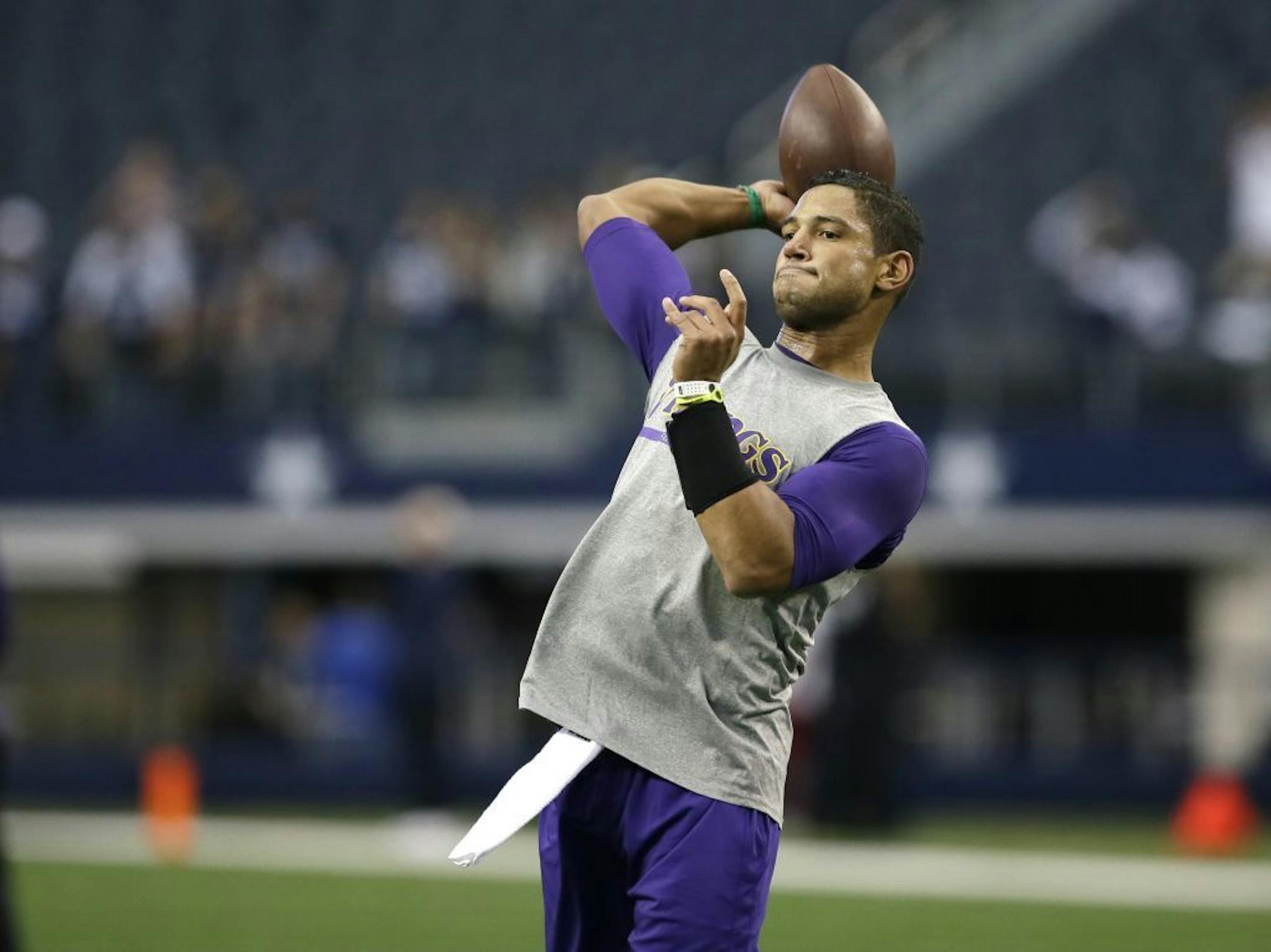 Minnesota Vikings quarterback Josh Freeman warms up during before an NFL football game against the Dallas Cowboys Sunday, Nov. 3, 2013, in Arlington, Texas.