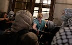 Students try to prevent the Gaza Solidarity Encampment from taking over Hamilton Hall at Columbia University on Tuesday, April 30, in New York. Columb