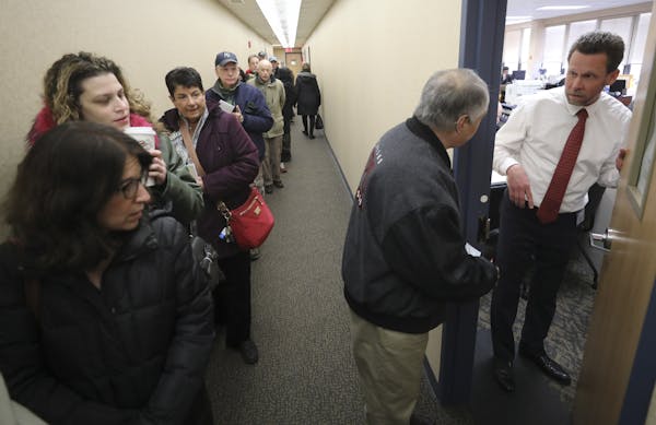 Part of a crowd of hundreds of people line up to prepay their 2018 property taxes at Clarkstown Town Hall in New City, N.Y., Dec. 28, 2017. Homeowners