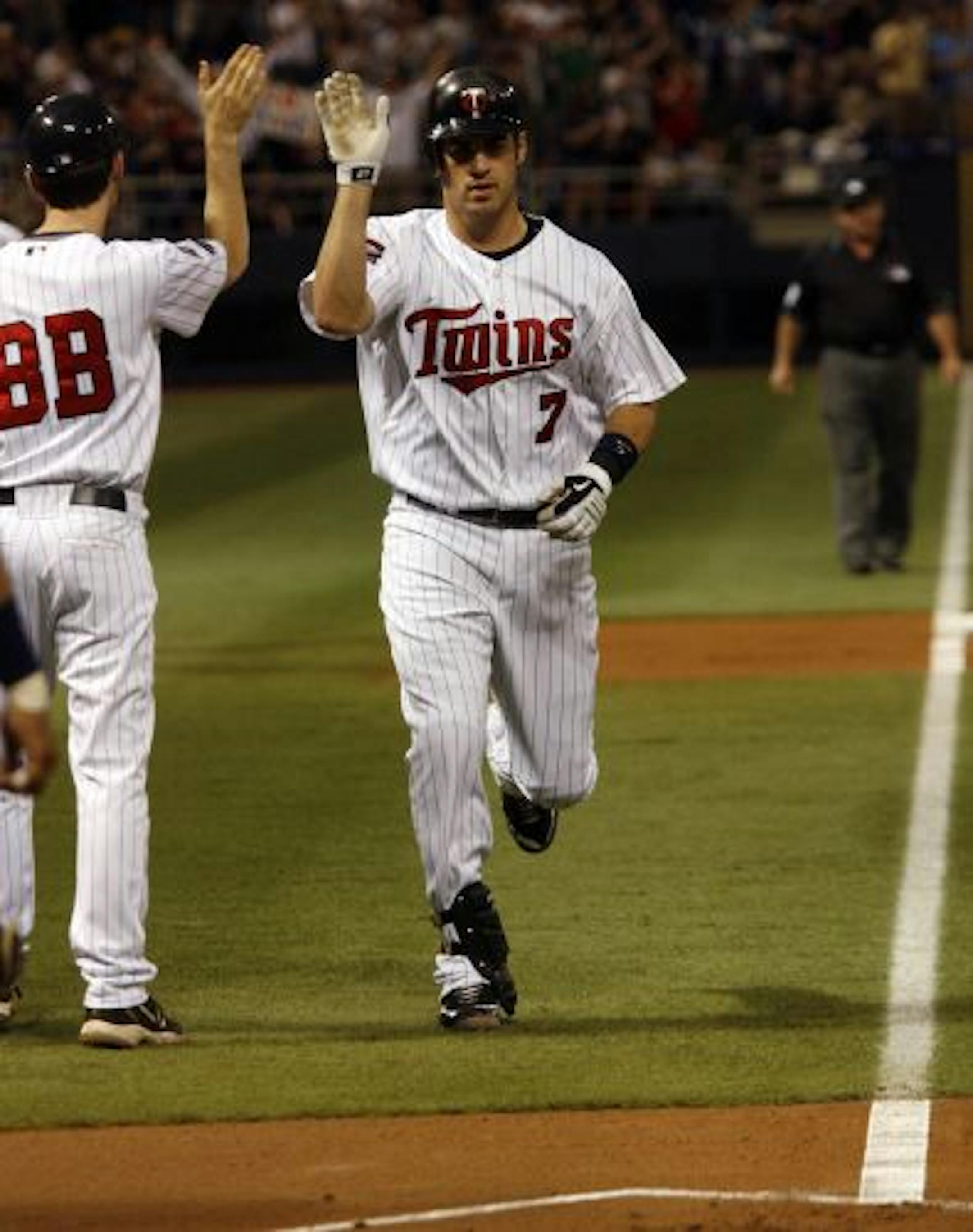Joe Mauer trotted home after his first-inning solo homer opened the scoring in a 6-3 victory over Milwaukee at the Metrodome.