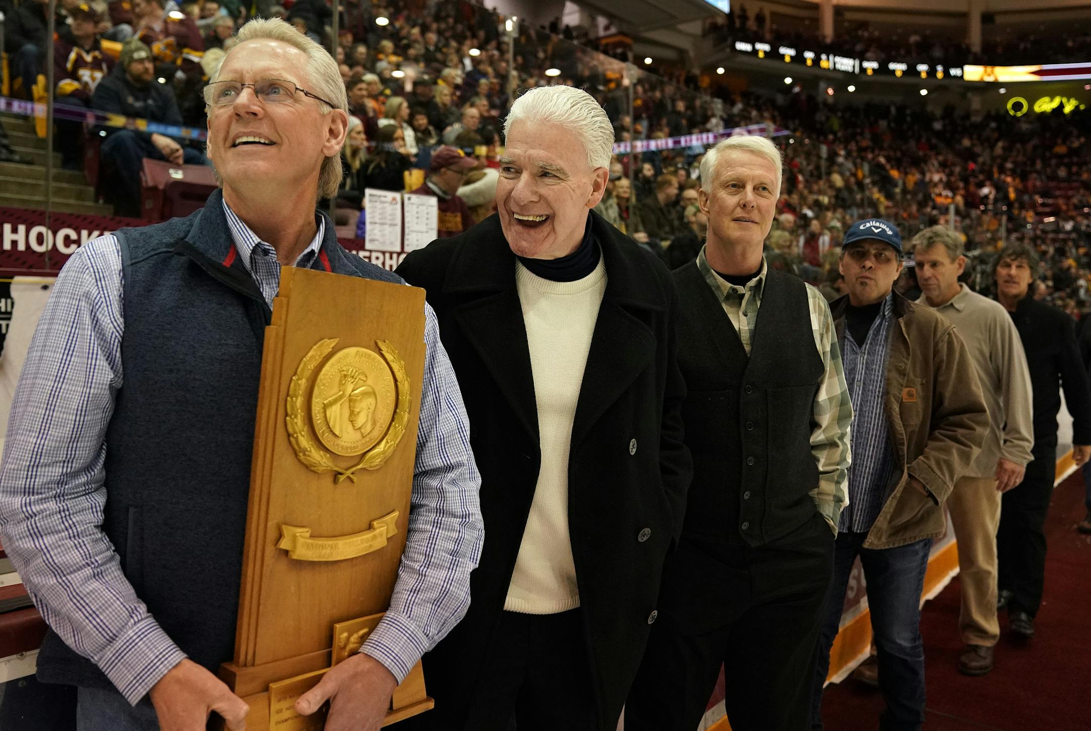 Bill Baker, left, captain of the 1979 Minnesota Golden Gophers' men's hockey team laughed along with former teammate Joe Baker, no relation, as they and their teammates were honored on the ice at the end of the first period. ] ANTHONY SOUFFLE &#x2022; anthony.souffle@startribune.com The Minnesota Golden Gophers played the Wisconsin Badgers in an NCAA hockey game Saturday, Jan. 26, 2019 at the 3M Arena at Mariucci in Minneapolis.